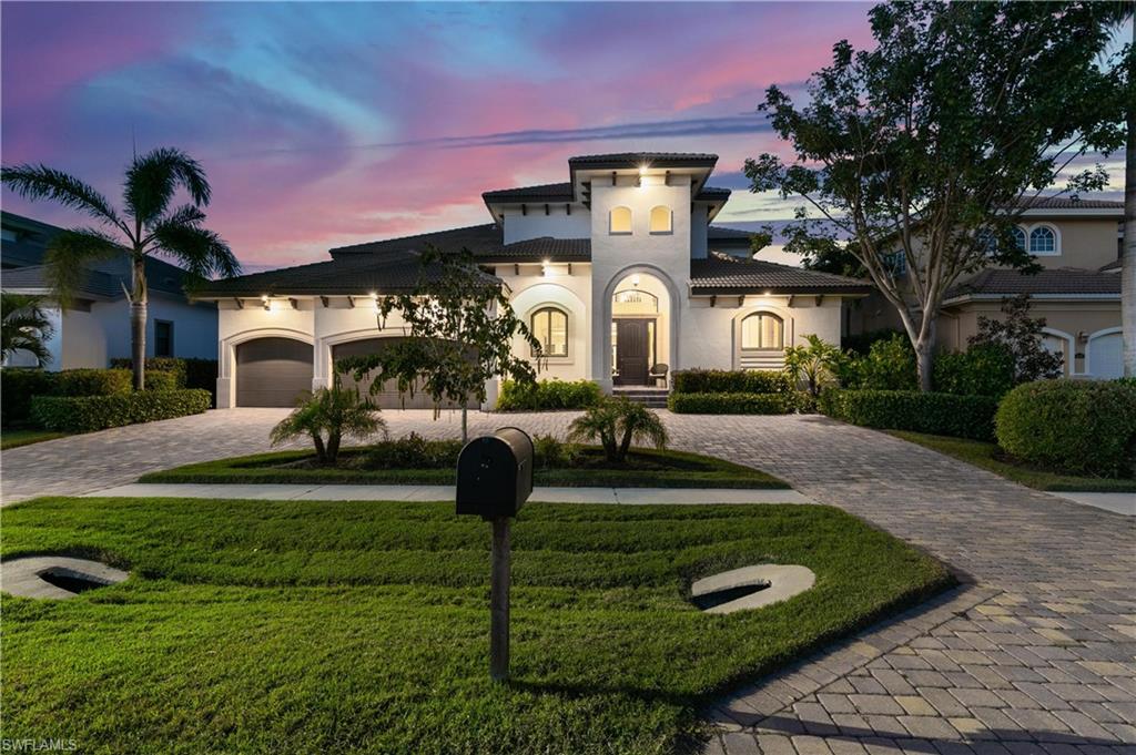 Walk in and say ''WOW!'' Elegant tropical waterfront home perfect for Marco Island living and entertaining! Spacious, bright 5 bedroom, 6 bathroom, 3 car garage built by Oakbrook Custom Homes in 2015 with elevator and generous separate living spaces both upstairs and down. All bedrooms have ensuite baths. Excellent rental potential. Spacious upstairs open balcony, screened pool and patio lanai. Upstairs living room with wet bar. Heated spa and pool with Aqualink system. Gorgeous interior finishes including tray ceilings and crown molding. Granite stainless kitchen with pot-filler faucet over stove, huge breakfast bar island, beverage cooler, wine cooler, walk-in pantry. Great-room layout with kitchen, informal dining and living areas. 2-story foyer, formal dining room. Hurricane impact sliding doors and windows. Huge 3 car garage for all the toys. Quiet street with multimillion dollar mansions... paradise awaits you! Close to shopping. 2 miles to Residents' beach