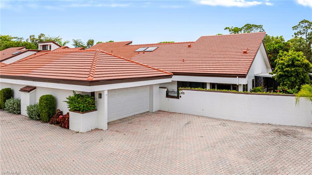Beautifully Updated 2 bedroom, 2 bath Villa in Harbour Castle. Soaring vaulted ceilings and hard surface flooring throughout, complemented by new modern trim, doors and several other updates for a fresh, contemporary finish.  The spacious great room offers an ideal layout for both everyday living and entertaining. The light and bright kitchen includes stainless steel appliances and granite countertops.  Retreat to the generously sized primary suite, which features an en suite bath with a separate walk-in shower and soaking tub, dual sinks, and a walk-in closet with custom built-ins. The second bedroom offers comfortable flexibility for guests or a home office. Enjoy Florida's outdoor lifestyle in your private pool area, a screened-in lanai and ample paver deck space, perfect for relaxing or entertaining year-round. A 2-stall garage provides plenty of storage and convenience.  Ideally located close to shopping, Harbour Castle offers the perfect blend of comfort, style, and convenience.