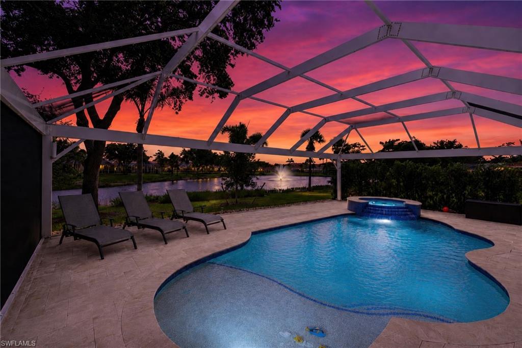 STOP SCROLLING—this is it! Fully renovated, beautifully updated, and loaded with big-ticket upgrades, this rare LAKE VIEW POOL HOME in The Reserve at Estero delivers effortless move-in-ready Florida living. This spacious Toll Brothers Tosara floor plan offers approximately 2,812 square feet of air-conditioned living space with 4 bedrooms + Den, 3 bathrooms, a 2-car garage, soaring ceilings, and a flexible two-story layout. Major peace-of-mind features include HURRICANE IMPACT windows throughout, a whole-house GENERATOR, and a newer 2023 roof. Located in the 24/7 guard-gated, natural gas community of The Reserve at Estero, nearly every major detail has been thoughtfully addressed, including pavers, pool equipment, kitchen, flooring, bathrooms, and outdoor living spaces. The updated kitchen makes an immediate impression with white cabinetry, a contrasting blue island, quartz-style countertops, stainless steel appliances, gas cooking, a sleek tile backsplash, and easy-care wood-look tile flooring that flows through the main living areas. A charming dining nook, formal dining area, and custom beverage station with wine storage and beverage cooler add even more function and style for hosting. The covered lanai is made for relaxed Florida living with multiple sliders, space for outdoor lounging and dining, an outdoor TV, heated saltwater pool, sun shelf, raised spa with spillover, generous covered seating, paver deck, and peaceful lake views framed by tropical landscaping and a fountain beyond. The FIRST FLOOR PRIMARY SUITE offers a comfortable retreat with tray ceiling detail, built-in storage, dual walk-in closets, and an updated en-suite bath featuring dual sinks, quartz-style counters, soft-toned cabinetry, and a frameless glass walk-in shower with beautiful tile detail. Upstairs, three guest bedrooms and an open loft provide plenty of room for visitors, family, work-from-home needs, media space, or hobbies. Residents of The Reserve at Estero enjoy a clubhouse, fitness center, resort-style pool, children’s pool, tennis, pickleball, basketball, and the peace of mind of a 24/7 guard-gated setting. Ideally located west of I-75 between Naples and Fort Myers, this central Estero address is near Miromar Outlets, Coconut Point, Gulf Coast Town Center, FGCU, Hertz Arena, RSW International Airport, world-class shopping and dining, and the white-sand beaches of Southwest Florida.