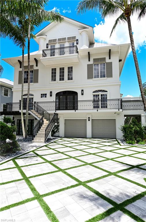 This totally renovated and updated Barefoot Beach Garden I home offers the widest Gulf views of any Barefoot Beach garden.  Completely rewired as a smart home and the interior was reimagined to 2021 design and finish standards.  Five en suite bedrooms, 7 baths, state of the art office.  Large open kitchen, dining, great room covered lanai plan with electric screens and shutters on bedroom and main living level.  Cloud room with large bar area and open 4th floor deck, overlooking the Gulf.  Finished to a very high level, private elevator, whole house generator, 3+ car garage, plus large storage areas and completely new landscaping, lighting, and custom designed driveway with pavers and turf.  Amenities include large pool, private beach, tennis and pickleball courts, fitness and clubhouse.  Option to purchase boat dock across the street and optional beach club with no waiting, (currently a one to two year wait).