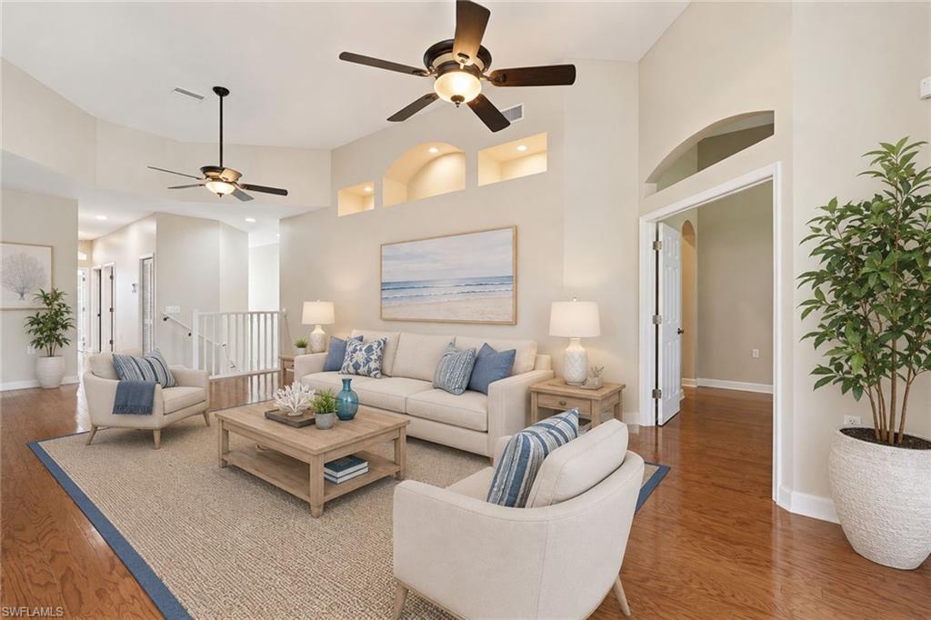 New 2026 roofs! This immaculate three-bedroom plus den residence offers a refined blend of quality updates and breathtaking scenery, showcasing panoramic golf course and water views from a premium corner setting. Bathed in natural light and enhanced by its desirable western exposure, the property features a screened corner lanai with hurricane-protected screens, the perfect backdrop for Southwest Florida’s signature sunsets. Thoughtfully upgraded and meticulously maintained, the residence reflects true pride of ownership, with plantation shutters throughout and a long list of meaningful improvements. The 2025 fully remodeled baths exude a spa-like ambiance, featuring quartz countertops, designer lighting, updated tile work, frameless glass shower enclosures and a luxurious rainfall shower with bench seating in the guest bath. The private primary suite is a serene retreat, complete with double-door entry, expansive windows framing the views, dual quartz vanities, a soaking tub, a glass-enclosed shower, separate linen storage and a custom walk-in closet with built-ins. This condominium showcases rich hardwood and tile flooring throughout and a spacious split-bedroom floor plan designed for both everyday living and effortless entertaining. A well-appointed den with glass double doors offers the ideal setting for a private office or media room, while the generously sized guest bedrooms feature abundant natural light and custom closet systems, providing both comfort and thoughtful functionality. Additional updates include a 2019 water heater, washer and dryer, stove, dishwasher, microwave, disposal and whole-home electric surge protectors. To complete the package, the immaculate garage is equally impressive, featuring epoxy flooring, built-in cabinetry and an upgraded garage door opener, track and chains. Residents of Oak Hammock enjoy a private community pool, fitness center and social room, as well as cable and internet included within the HOA fees. Shadow Wood Country Club offers 54 holes of championship golf, tennis, bocce, dining and social activities. A new lifestyle amenity center planned for completion by the end of 2026 is expected to feature resort-style pools, indoor pickleball courts, Har-Tru tennis courts, restaurant and bar service, a racquet pro shop and a café. The Commons Club offers additional optional amenities, including a private beach club, fitness center, spa, outdoor pickleball courts, dining, social events, a playground and a resort-style pool with lap lanes. Memberships to Shadow Wood Country Club and The Commons Club are optional. One or more photo(s) has been virtually staged, AI-generated or rendered.