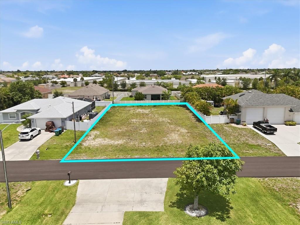 Build your dream home in one of Southwest Cape Coral’s most desirable neighborhoods! This cleared lot offers a fantastic opportunity to build surrounded by beautiful newer homes in a quiet, well-maintained area. Enjoy easy access to Cape Harbour, Tarpon Point, shopping, dining, parks, and nearby beaches, while still having a peaceful residential feel. City water and sewer assessments are in and fully paid, adding tremendous value and convenience for future owners.
