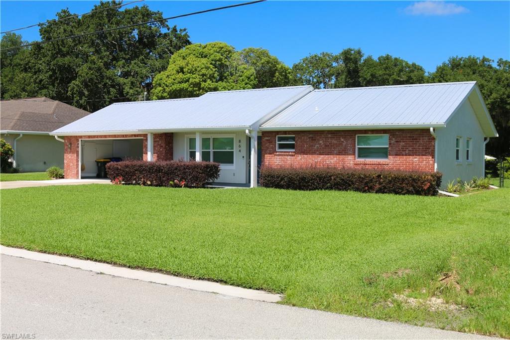This beautiful updated 2-bedroom, 2-bath home offers direct access to a freshwater canal and lake, complete with a private boat hose, covered boat dock, boat lift, jet ski lift, and seawall-perfect for boating, fishing, or simply enjoying the peaceful view.

Situated on a fenced lot with no HOA, this move-in-ready home has been extremely renovated inside and out. Major improvements include a metal roof on both the home and boathouse, impact-rated windows and doors, remodeled kitchen and bathrooms, new HVAC and ductwork, updated appliances, new tile flooring throughout, fresh interior and exterior paint, gutters, driveway, walkway, screen porch, fixtures, water heater, well pump, irrigation pump, drain field, and more.

The open kitchen features an island, bar seating, and stainless-steel appliances, while the spacious primary suite offers dual sinks and beautifully updated bathroom. Step outside to the large screened lanai overlooking the water, where you can relax or entertain year-round. 

Additional features include a 2-car garage, automatic sprinkler system, owned water treatment system with softener and filtration, laundry tub, fenced backyard and lush new landscaping.

Whether you're looking for a full-time residence, seasonal retreat, or waterfront gateway, this meticulously maintained Lake Placid property checks all the boxes.
