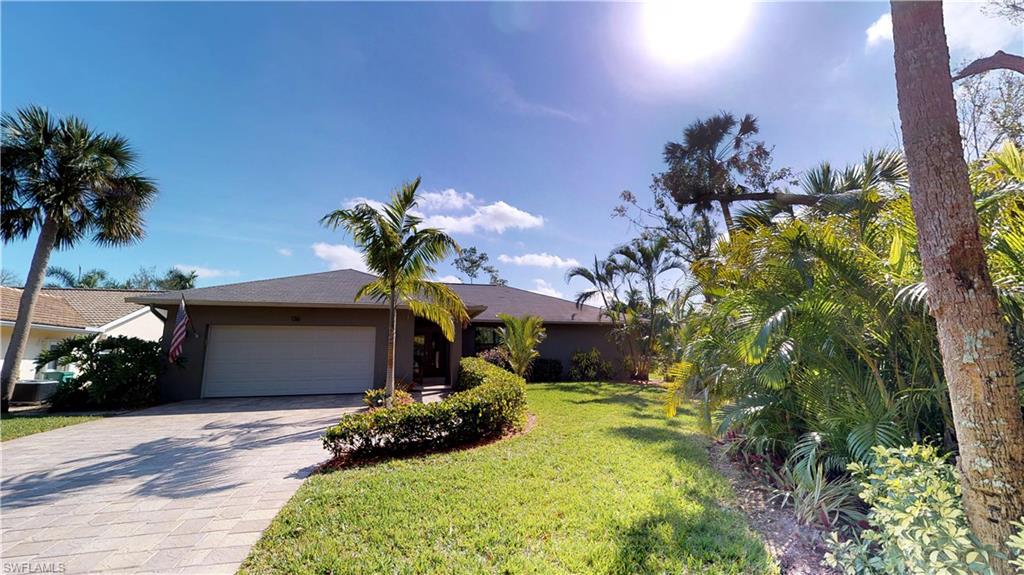 Must see this beautiful 3 Bedroom and 2 Bathroom home on nearly half an acre in Palm River Estates. Kitchen has wood cabinetry, natural stone quartz countertops, and bar style eating area. The floor plan is open  and airy with vaulted ceilings.  Solar heated pool and screened lanai overlooking a lushly landscaped area. Also, this home has a nice side yard for relaxation and entertaining. This home also features nicely updated bathrooms, fabulous tile flooring, impact windows and doors. A truly special home  and private oasis with no HOA fees