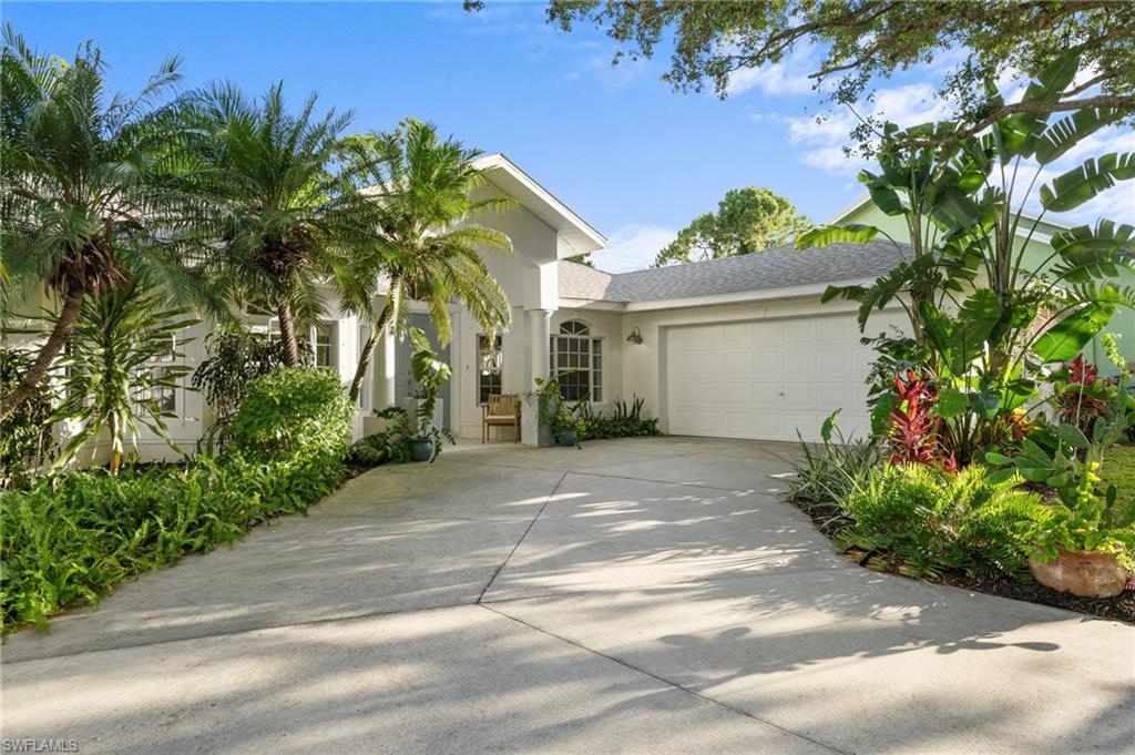 Tropical Preserve-View Retreat in North Naples | Updated Home | Fully Furnished Option | Low HOA.
Tucked against a protected preserve, this North Naples home offers rare privacy on a quiet, walkable street in Falcon Ridge. Beautifully maintained and framed by lush tropical landscaping, it blends comfort and effortless Florida living. Set on one of the community's elevated streets, where flood insurance is not currently required, and benefits from low-density living with HOA fees of just $500/year. Move-in ready, with the option to purchase fully furnished, down to furnishings, décor, kitchenware, and everyday essentials.
From the moment you arrive, the mature live oak, charming front yard, and inviting curb appeal create a warm first impression. Inside, vaulted ceilings, rich wood flooring, and abundant natural light enhance the airy open-concept design. Large windows frame peaceful garden views from nearly every room.
The kitchen opens generously to the main living space, with ample counter space and storage that make it as functional for everyday cooking as it is for hosting. Multiple accesses connect the main living spaces to the Florida room and outdoor areas, making it easy to enjoy both indoor and outdoor living.
The well-designed floor plan includes two front guest bedrooms, one currently styled as an office and music room, a third bedroom, and a spacious primary suite tucked privately toward the rear of the home.
Major updates provide peace of mind, including:
-New roof (2024)
-HVAC system (2023)
-Water heater (2024)
-Several new appliances (2026)
Currently zoned for Veterans Memorial Elementary, North Naples Middle School, and Aubrey Rogers High School. School assignments should be independently verified by buyers.
One of the home’s most unique features is its curated tropical permaculture garden, offering an extraordinary collection of mature fruit trees and edible landscaping, creating a truly private backyard oasis, unique in North Naples.