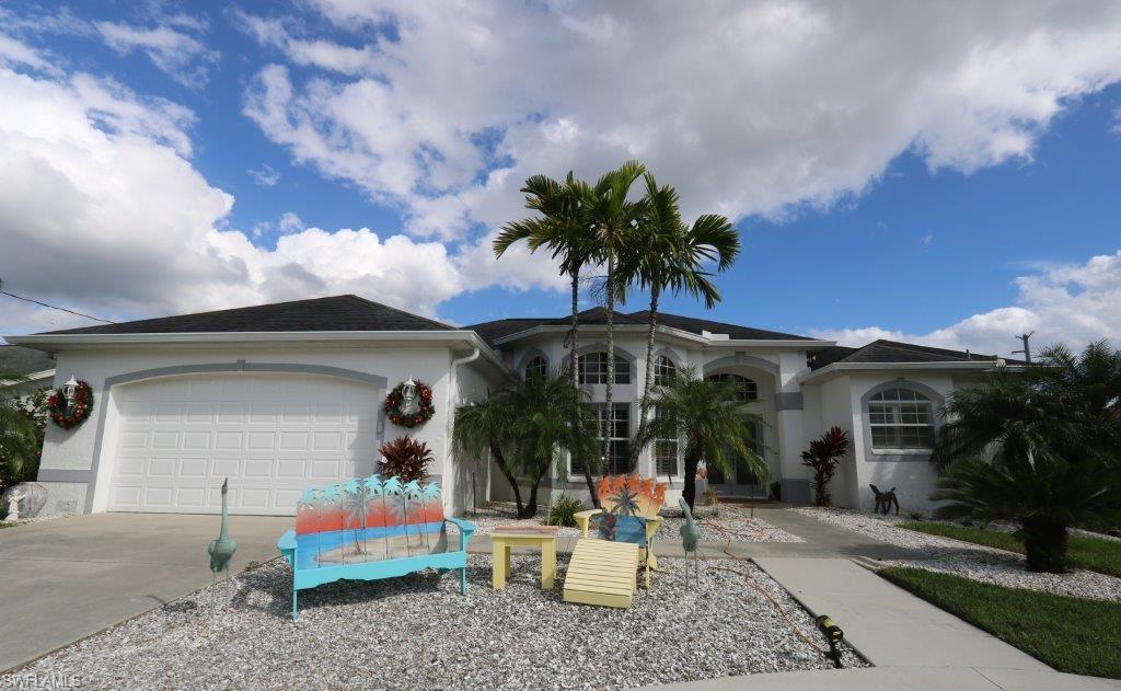 This “Bonita Farms” beauty offers the best of all worlds – a beautiful great room style plan with a wide beautiful canal and an oversided back yard.  The floor plan of this home features a central living area with cathedral ceiling.  The kitchen with granite counter tops is open to the main living area and features a great view of the pool and back yard/canal.  The floor plan is split for privacy with the master suite on one side and the guest bedrooms on the other side of the home.  The third bedroom offers a murphy wall bed system.  The exterior features of the home include back yard fencing with a separately fenced dog run, fruit trees including citrus and mango, a brick paver sitting area, a brick paver fire pit area, fully sea-walled with brick paver finished embellishments and sitting area, large storage shed tucked to the side and an electric boat lift.  It’s approximately a 40-50 minute ride to the gulf. Boats can be rented at Baywater Exclusive Boat Club on Bonita Beach Road to test the drive.