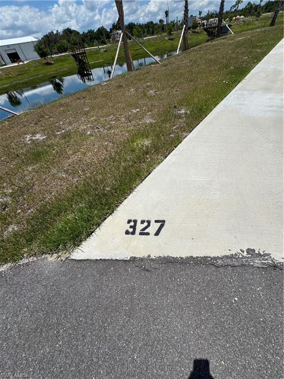 Welcome to Lot 327 at Palm Breeze RV Resort, an exceptional oversized lakefront RV lot offering water views on two sides and a beautifully landscaped setting. Ideally situated at the end of a quiet cul-de-sac, this premium lot provides added privacy and minimal traffic, enhancing the peaceful resort atmosphere.

With its expansive footprint and unique waterfront positioning, this lot captures panoramic water views while offering flexibility to design your ideal outdoor living retreat. There is ample room for a tiki hut, outdoor kitchen, expanded paver pad, fire feature, and upgraded tropical landscaping to create a true luxury RV oasis.

Enjoy tranquil waterfront living while remaining convenient to Palm Breeze’s upscale amenities, including the heated resort-style pool and spa, clubhouse with fitness center, pickleball courts, and vibrant social spaces. Located near I-75 and just minutes from Southwest Florida’s beaches, shopping, and dining.

Oversized lakefront RV lots with water on two sides and cul-de-sac privacy are rare within the community. Lot 327 presents a premium opportunity in one of Punta Gorda’s newest luxury RV resorts.