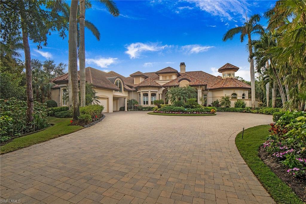 Welcome to your dream home, where resort-style living meets timeless elegance. This stunning custom-built Contessa residence features a spacious primary suite with dual baths and custom closets, three guest bedrooms, a den, office, media room with kitchenette, formal living and dining areas, a family room and 5.5 baths. The beautifully landscaped circular driveway sets the tone for the grandeur that awaits. Inside, you’ll be captivated by breathtaking views, cathedral ceilings and sophisticated design. With over 7,000 square feet of living space and 5,400 square feet of outdoor space, natural light flows through expansive windows and sliding doors, creating an airy, open ambiance. Recent updates, including a new roof, modern appliances, updated pool equipment, new water heaters and lanai sunscreen, ensure peace of mind for years to come. The gourmet kitchen is a chef’s dream, featuring a Dacor gas range, Sub-Zero refrigerator, wet bar and wine room, flowing seamlessly into the family room for effortless entertaining. Step outside to panoramic views of the serene lake and lush golf course, complemented by an oversized lanai with built-in outdoor kitchen, dining areas and a stunning infinity pool with spa. With a three-bay garage, ample storage, a bonus workout room and a spacious laundry room, this home blends functionality and style. Designed at a 14.5-foot elevation, it includes a generator and automatic storm shutters. Fully furnished and move-in ready, this home is an oasis. Bonita Bay offers exclusive amenities and five championship golf courses, membership required.