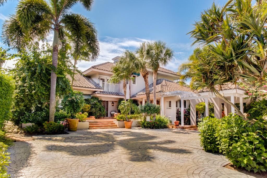 Paradise awaits you at this private and gated beachfront home with 100 Ft of Gulf frontage.This stunning Sanibel beachfront estate offers dramatic gulf front views & a warm & inviting pool area. The spectacular setting begins upon arriving through a gated entry into a courtyard compound. Beautiful arched breezeways weave through landscaped gardens. The main house features 4 bedrooms, custom wood details, an English gourmet kitchen, & a grand master suite. The 1,800 sq. ft. guest house offers large private quarters including an studio, fitness room w/sauna, & a wine room. Sink your toes in the white sandy beach, celebrate the breathtaking sunsets, these are a few special treats awaiting you.