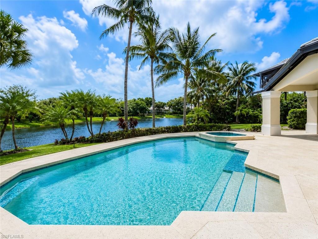 One or more photo(s) has been virtually staged, AI generated or rendered.  Presenting an extraordinary lakefront opportunity in Waterford at Pelican Bay. Situated on an exceptional oversized .51-acre cul-de-sac homesite, this property commands panoramic 180-degree lake views and unparalleled privacy within this prestigious community. With 6,971 square feet under roof—including 4,847 square feet under air—across five bedrooms, a study, five full baths, a dedicated guest wing with studio, and a three-car garage, the residence provides an exceptional canvas for modernization, sophisticated renovation, or complete custom new construction redevelopment—a rare opportunity to build your dream estate on one of Pelican Bay's most coveted waterfront sites. The existing floor plan features soaring volume ceilings, expansive living spaces, a formal dining room, family room, wet bar, and a luxurious primary suite with retreat area. A whole-house generator ensures reliable backup power. The 3,043-square-foot screened lanai overlooks expansive lake vistas and features a pool and spa, with clear potential for thoughtful enhancement and reimagining. 
Waterford at Pelican Bay offers a rare single-family estate-home setting within one of Naples' most recognized coastal communities. Tucked into a quiet cul-de-sac enclave, the neighborhood features spacious homes on oversized homesites surrounded by mature tropical landscaping. Residents enjoy exclusive access to three miles of private white-sand beaches, beachfront dining, tennis and pickleball facilities, scenic walking paths, and world-class amenities—moments from Naples' finest shopping, dining, and cultural destinations. This is Pelican Bay luxury—private, timeless, and designed for exceptional coastal living. An exceptional blank canvas for the discerning buyer seeking luxury, location, and limitless potential.