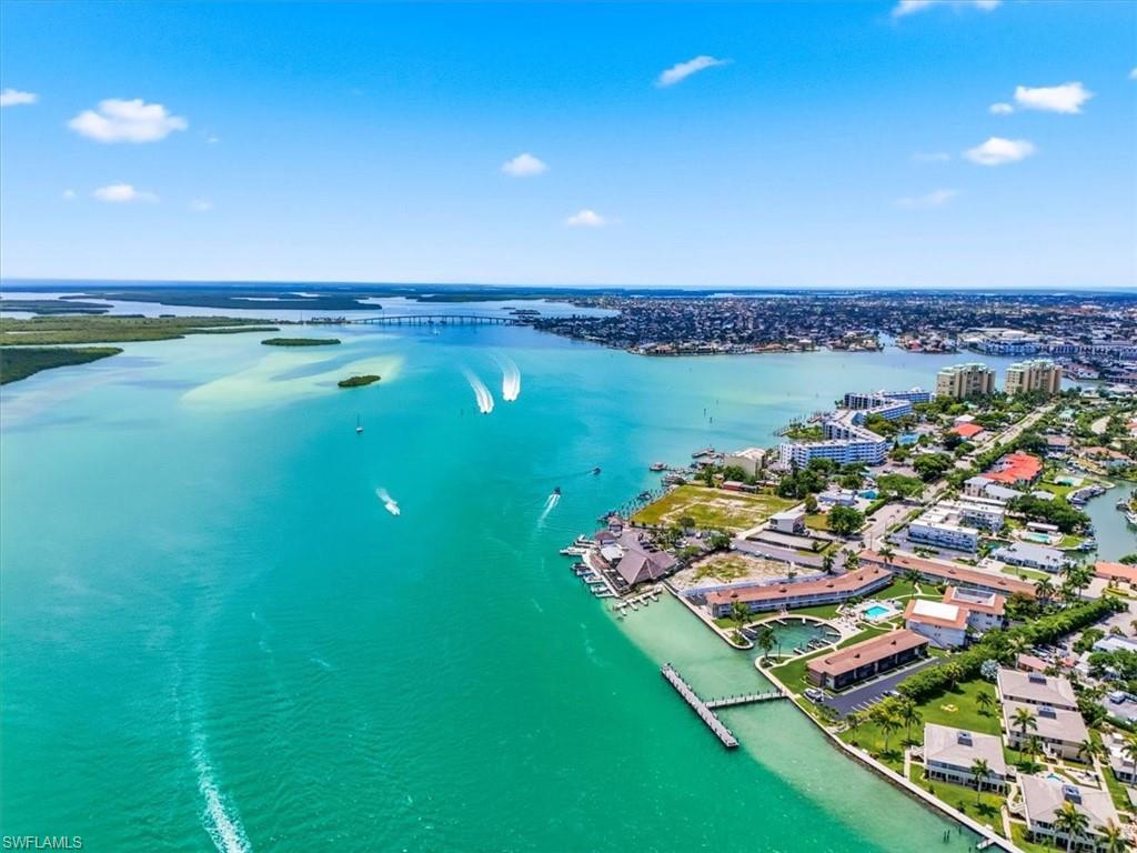 Best value opportunity in South Seas! Enjoy the ease of first-floor living with no elevators or stairs, offering unmatched convenience for full-time residents, seasonal owners, or investors. This turnkey 2-bedroom, 2-bath condo is clean, well-maintained, and ready for immediate use or rental income. Ideally located just steps from beach access, this unit provides an affordable entry into Marco Island's highly sought-after communities. Impact windows coming soon, adding immediate value and peace of mind for the next owner. South Seas offers an unparalleled lifestyle with its array of amenities. Whether you're docking your boat in the bay, enjoying private beach access, or engaging in a friendly match on the clay tennis and new pickleball courts, this community has it all. The two heated condo pools are perfect for relaxation, complete with a charming Chickee hut and four barbecue grills for entertaining. For the outdoor enthusiast, kayak storage and boat docks are available for rent at very reasonable rates. Engage in a game of bocce or shuffleboard, or practice your swing on the putting green. With its prime location, South Seas is within walking distance to a variety of restaurants and shops, making it one of the few guarded gated communities that truly offers everything you desire. Experience the epitome of coastal living in this stunning Marco Island condo, where every detail has been crafted for your enjoyment.