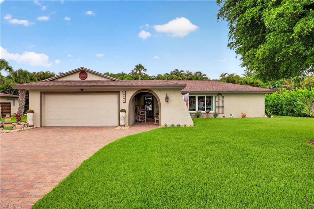Adorable home ideally located just three lots from the river and directly across from gulf-access properties, surrounded by multimillion-dollar homes. This charming residence offers both an exceptional location and incredible potential.
A spacious front porch welcomes you into the foyer, leading to a cozy living room featuring a fireplace and a separate dining room—perfect for everyday living and entertaining. The home includes 3 bedrooms and 2 bathrooms, offering a functional and comfortable layout.
The galley-style kitchen overlooks a large family room, creating a great flow for gatherings. Step outside to the screened lanai, an ideal spot to relax and enjoy Florida living year-round. The backyard also features a detached workshop, perfect for hobbies, storage, or projects.
Conveniently located near shopping, dining, and just a short drive to area beaches, this home combines charm, location, and opportunity in one desirable package