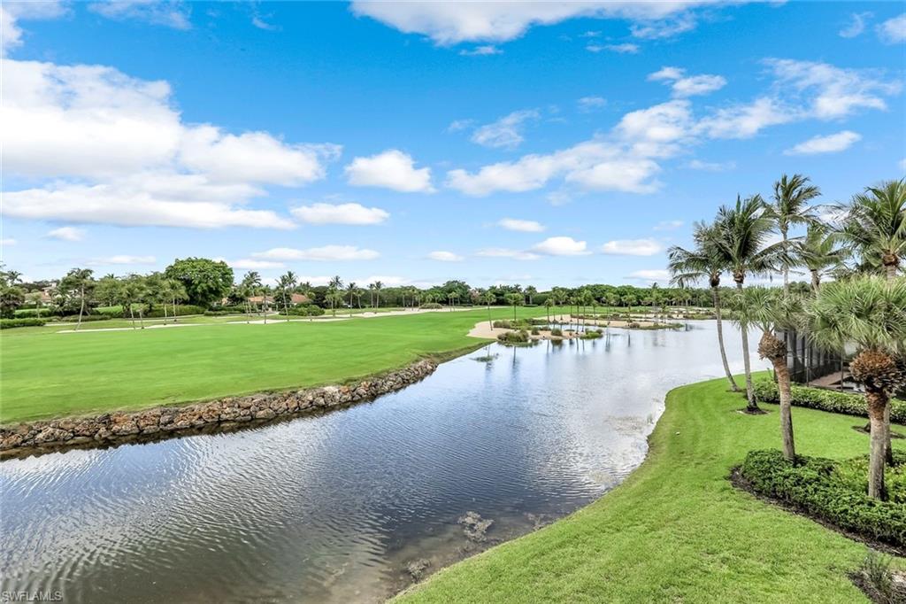 Stunning views in Grey Oaks and an immediate Full Golf Membership is available. Huge windows, soaring ceilings and tons of light welcome you to this clean 4 + Den escape in the best golf community in Naples. Dramatic southern to southwestern views across a huge lake & hole 17 of the Palm Course. There's a very generous kitchen with functional layout open to the family entertaining area where you'll find seating for 12. The second floor offers two private suites with access to a huge balcony where you can enjoy the views and the sunset. Two bedrooms on main level plus a home office with built-ins. The family room has two-story ceiling height and is surrounded by windows. You'll love the space here - seating for at least 12. Fresh paint throughout, new hot water heater, new washer & brand new roof in 2024.