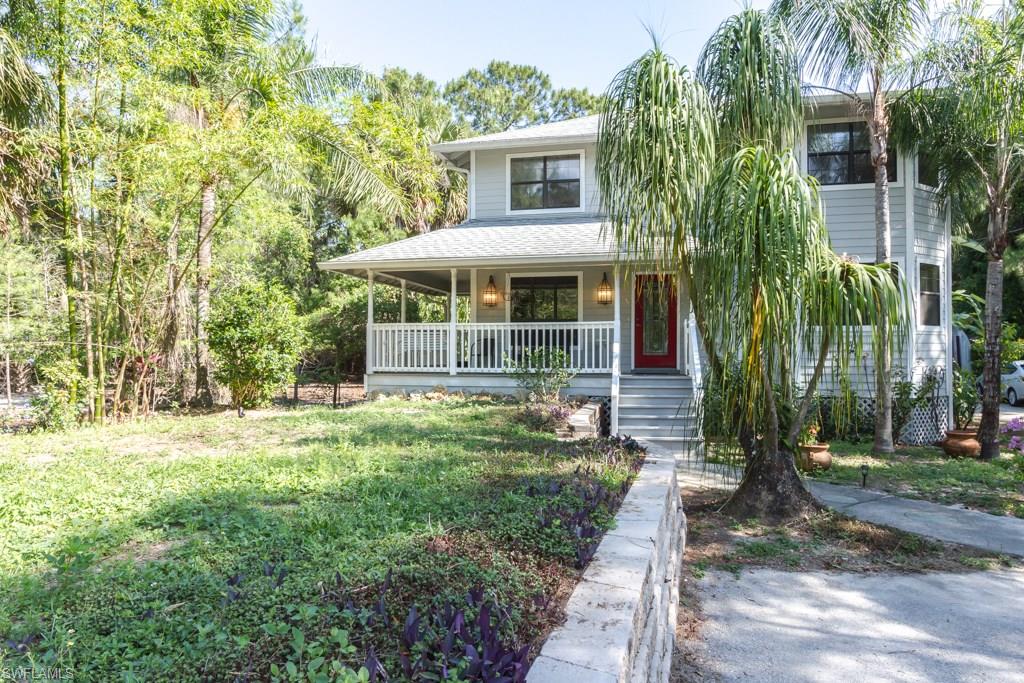 Lovely 2 story home with newer roof, a/c and water softener system (all 3 years old) located close to the new Publix in N. Naples!  This wonderful home offers a wrap-around porch with old-fashioned swing, inviting back screened porch area with fireplace and plenty of room for parking your vehicles, boat, etc.  The home was re-done about 3 years ago with new tile added downstairs, new washer and dryer, newer appliances and great open kitchen with dining area. The spacious living room has crown molding and French doors to the lanai/porch.  The Master Bedroom has a great bay window offering plenty of light. This home is priced to sell and is being offered partially furnished also.  There is a 1 car detached garage and storage shed on the property and a long driveway.