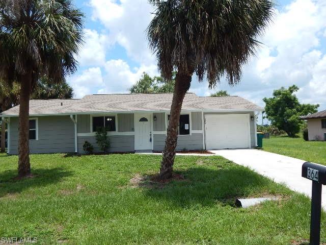Well maintained 2 bedroom, 2 bath home located in a nice neighborhood. New laminate floors in main home and all wet areas. New carpeting in bedrooms. Neutral interior paint. Newer HVAC and roof. Separate living and dining rooms, kitchen offers black appliance package to include, dishwasher, microwave, range and refrigerator. Garage also has a side door entry, sliders out to the screened lanai. Call your Realtor for a private showing today.