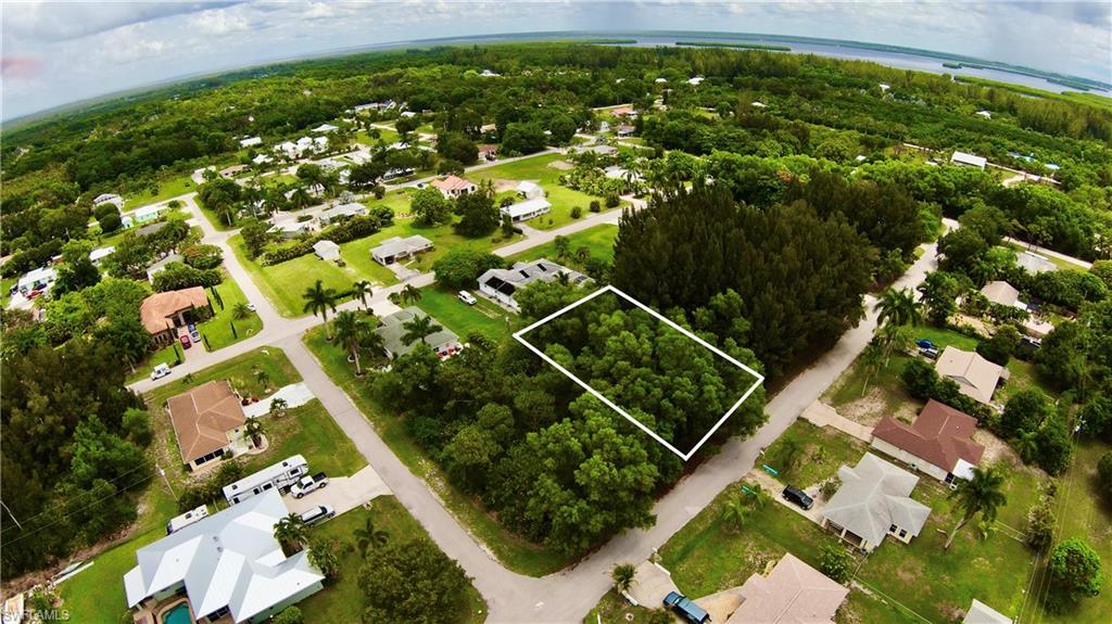 Good standard-sized lot in a great area in Bokeelia known as the "Fish Streets". High and Dry, not in a flood zone, no flood insurance required! Ready to build your dream home on one of Florida's greatest coastal islands, come live the Island Life! Minutes to Cape Coral, I-75, shopping, restaurants, golf, and great schools. Lot measures 78x125. Will need to be cleared. Financing available. Neighboring lot 5892 Porpoise Rd is also available, could be sold as a package deal. Call for details