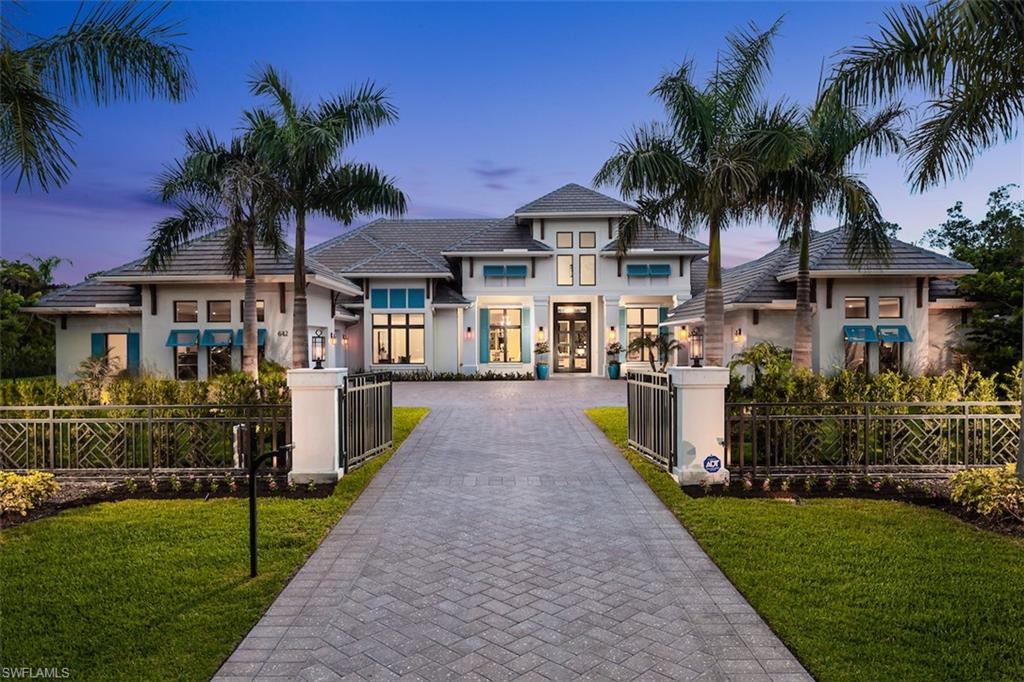 New, spacious, and oh-so-stylish coastal contemporary 1 story gated estate home, sited on a sprawling 1 1/4 acre lot in the heart of Pine Ridge Estates. The open concept floor plan featuring both great room and family room, with thoughtful details such as soaring ceilings, gas fireplace, artfully crafted ceiling details, floor to ceiling windows, and wide plank wood floors grace every room. The master suite is surrounded by windows, features a private bar, sitting area, separate his and hers walk in closets, a generous master bath with soaking tub, dual vanities, spa like shower, and outdoor shower. The chefs kitchen boasts Wolf and Subzero appliances, a huge walk-in pantry/catering area, custom cabinets, and 12’ center island. All open to a gorgeous family room flooded with light from twin pocketing glass walls that open to a spectacular outdoor living area, perhaps the main feature of this gorgeous home. Imagine an outdoor great room, fire pit, fireplace, kitchen and dining, all over looking a luxuriously landscaped private backyard with resort size pool/spa. A dining room, private office, 3 en-suite guest bedrooms. 5 garages and a private gated entry complete the package.