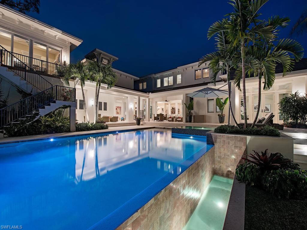 Location. Award winning architecture. Quality craftsmanship. Situated just steps to one of Naples’ pristine beaches and the renowned 3rd St. S. shopping/dining district. Designed by MHK Architecture & Planning this custom home is infused with their signature, classic old Florida attributes. Waterside Builders Inc. has again crafted a home that is above the bar offering peace of mind and long term value. Comfortable, open floor plan provides a feeling of space; a seamless transition from indoor to outdoor living areas. Massive, covered, climate controlled outdoor living area leads to the gracious pool/spa and the almost spa-like, expansive grounds unique in the marketplace. Large master suite offers a quiet office, his and her closets, gorgeous bath with walk-in shower and soaking tub. The home offers the Lutron system and the ability to control the lighting, ACs, pool/spa and 65 KW whole house generator remotely. Fantastic kitchen with Thermadore and Miele appliances as well as a prep-kitchen with additional gas range/oven and fridge. There’s a 600 bottle wine room as well. 3 garage bays with the ability for 3 lifts; 2 bays insulated and climate controlled. A fantastic opportunity.