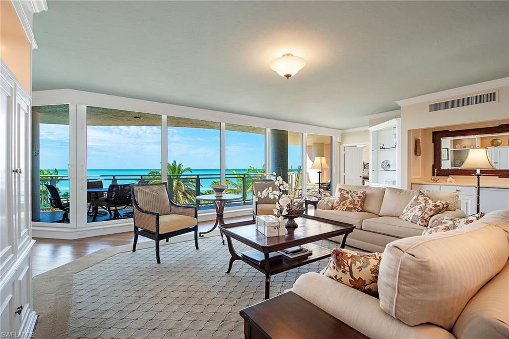 This stunning beachfront residence offers breathtaking Gulf views and over 3,400 square feet of luxurious living space. Featuring three bedrooms, a den and three-and-a-half baths, the home boasts a well-designed floor plan with split bedrooms, separate living and family rooms and a formal dining area. The pristine interiors include hardwood flooring, new impact windows and sliding glass doors, with a spacious unscreened terrace ideal for enjoying beach and Gulf vistas. Additional perks include two deeded parking spaces in a secure garage and an air-conditioned storage locker. Exciting improvements are underway! The building’s roof was just replaced, and the lobby and amenities are currently undergoing a full modernization, expected to be completed by October 2025. Additionally, a full renovation of the front entry and pool deck area is in progress, with anticipated completion by Q2 2026. Once finished, these upgrades will enhance the entire property, creating a beautifully updated and enjoyable environment for owners to relax, entertain and call home.