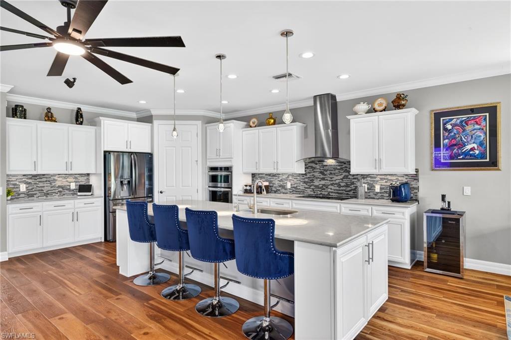 Price Reduced! PINNACLE MODEL ON PREMIUM GOLF & LAKE FRONTAGE LOT ON THE 10th HOLE OF PANTHERS RUN GOLF COURSE! Includes Golf Cart and Generator! Ave Maria Resort Living at Del Webb 55+ — 3BR + Den, 3BA, 3-car garage on quiet, well-lit cul-de-sac w/sidewalks on each side of street* Southwest Lake & Golf Views w/spectacular Florida sunsets* Ranch-Style Layout — no stairs, ~2,500 sq ft, open & manageable * High Ceilings & Crown Molding with upgraded LED lighting/dimmers * COREtec Waterproof wood Flooring throughout with soft-foot padding * Chef’s Kitchen — white satin cabinetry w/pull-outs, Silestone 10'+ island, RO system, walk-in pantry, coffee nook * Den with Custom Built-Ins — easily converts to 4th bedroom * Oversized Primary Suite — tray ceilings, lake/golf views, spa bath, step-in shower, electronic bidet seats in each of the 3 full baths * Guest Suite + Murphy Bed Room — both with walk-in closets * Upgraded Laundry Room — extra storage, sink, high-capacity machines * Expanded Screened Lanai — waterfall feature, LED lighting, bubbling spa * New 4-Person Hot Tub under covered area w/remote hurricane shutters for full privacy * Storm Protection — 2 electric roll-downs, panels, whole-home surge protection * 10kW Generator w/35-gal reservoir & dual electronic monitors * Epoxy-Floor Garage — overhead racks, quiet belt-drive GARAGE DOOR OPENER, fresh paint * Over 30' of Elevation above sea level — modern drainage, underground utilities, no flood insurance required * Walk/Golf-Cart to Amenities — Rusty Putter Restaurant, 2 resort pools, gym, tennis, pickleball, bocce * Ave Maria Conveniences — Publix, dining, banking, salons, dog parks, house of worship * Everglades Border — peaceful, secure, abundant wildlife * CUSTOM AUDIO AND VIDEO PACKAGE negotiable— Bose surround sound & custom systems * Furniture Negotiable * Yamaha self-playing piano negotiable *  * MUST SEE! RARE OPPORTUNITY FOR ACQUIRING A WELL MAINTAINED HOME IN WHAT RESIDENTS REFER TO AS PARADISE ON EARTH...IN A GATED DEL WEBB COMMUNITY.