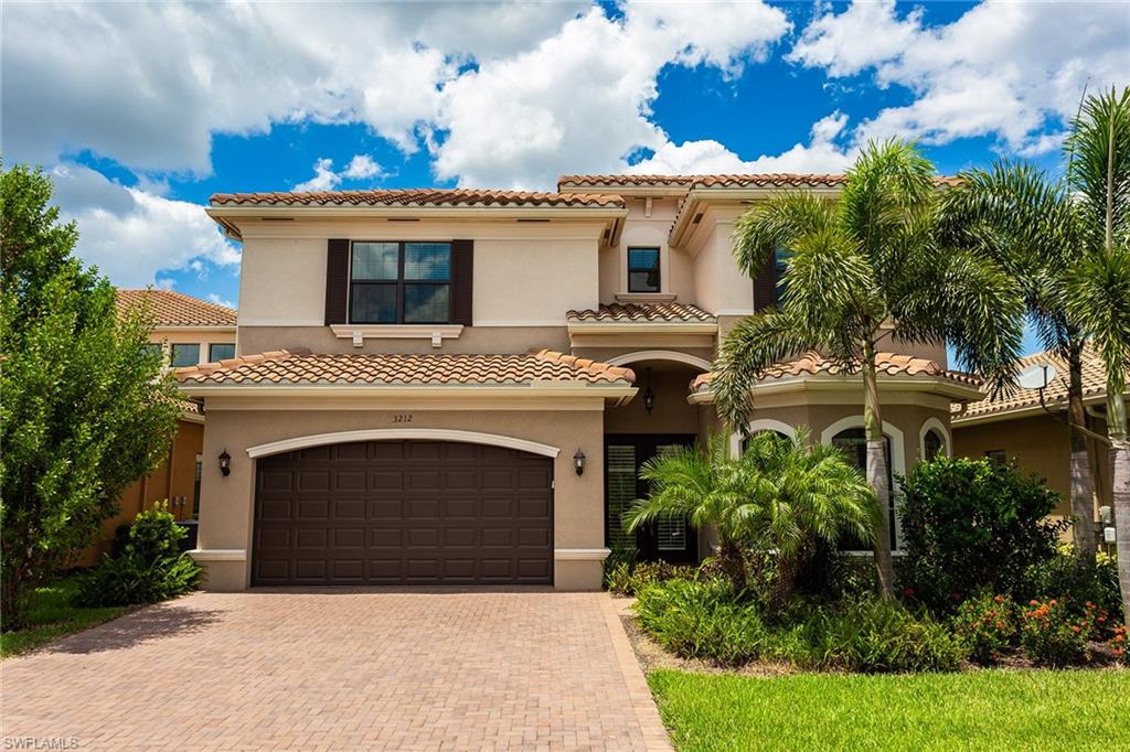 Spectacular pristine lakefront home in the resort community of Riverstone. This rare and barely lived in Riesling floor plan is bright and airy with volume ceilings, generous rooms and elegant finishes throughout. Entertain friends and family in the open kitchen featuring a breakfast bar with seating area, center island prep, beautiful granite countertops, stainless steel appliances and custom wood cabinetry. Or move the party outside to the saltwater pool and spa with a large lanai and beautiful lake views. Upstairs there is a tranquil master suite with its own screened balcony overlooking the lake, as well as his and her master baths, a soaking tub, a walk through shower and huge walk-in closets. Three additional roomy upstairs bedrooms stay organized with large closets. The residence also features a bedroom downstairs, offering privacy for guests. The loft/bonus room is a popular spot to watch the game, play ping pong or use as homework studio. Riverstone is located in A-rated schools, minutes away from I-75, 15 minutes from the beach and less than 25 minutes to Southwest Florida International Airport.
