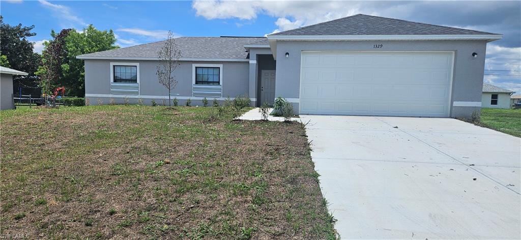 Experience the perfect blend of modern design, quality craftsmanship, and everyday comfort in this stunning new construction home located in one of Northeast Cape Coral's most desirable and rapidly expanding neighborhoods. Boasting 1,505 square feet of thoughtfully designed living space and 2,005 total square feet, this exceptional residence features a highly sought-after split-bedroom floor plan with 3 spacious bedrooms, 2 elegant bathrooms, a generous 2-car garage and an open lanai at the back for your relaxation. The open-concept layout creates a bright and inviting atmosphere, highlighted by a beautifully appointed kitchen with stainless steel appliances, abundant workspace, and seamless flow into the main living and dining areas. Step outside to the expansive rear lanai, an ideal extension of the living space for entertaining guests or enjoying Florida's year-round outdoor lifestyle. Enhanced by attractive curb appeal, quality finishes, and a prime location near shopping, dining, schools, healthcare facilities, and recreational amenities, this home delivers outstanding value and exceptional livability. Take advantage of this opportunity to own a brand-new home in one of Cape Coral's most promising growth corridors.