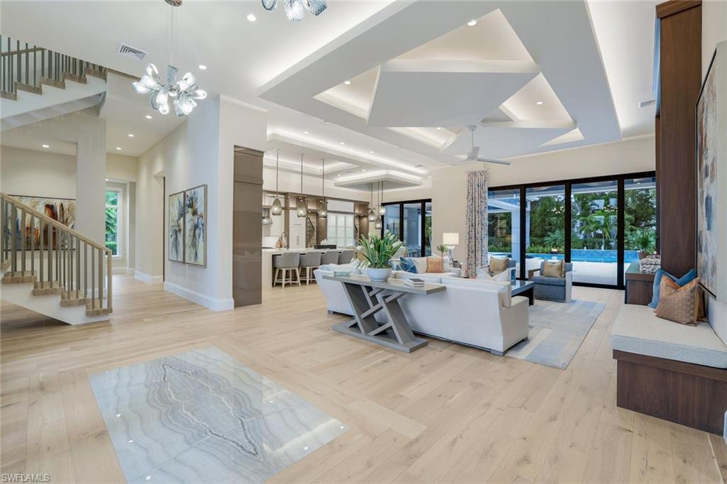 Welcome to an extraordinary 5-bedroom plus den, 8-bathroom estate in the exclusive Pine Ridge community. This two-story masterpiece is crafted with impeccable attention to detail and features top-of-the-line finishes throughout.

The chef’s kitchen is a showstopper, with a grand island, sleek countertops, a gas cooktop, and custom cabinetry. High-end appliances and designer fixtures create a space that is as functional as it is stunning. Elegant hardwood and marble flooring, soaring ceilings, and intricate millwork enhance the luxurious atmosphere.

The primary suite is a private retreat with dual walk-in closets and a spa-like bathroom featuring a soaking tub and oversized shower. Each additional bedroom boasts en-suite baths with premium finishes.  For your guests, there is a private retreat featuring one bedroom, bathroom, a living space, and kitchen. And as a bonus there is a full house generator for added comfort.

Step outside to your backyard oasis, complete with a sparkling pool, a fully equipped outdoor kitchen, an outdoor fireplace, and expansive seating areas. A second-story balcony offers serene views of the lush landscaping, perfect for enjoying morning coffee or evening sunsets.

This home seamlessly blends elegance, comfort, and modern convenience, delivering the ultimate Southwest Florida lifestyle.