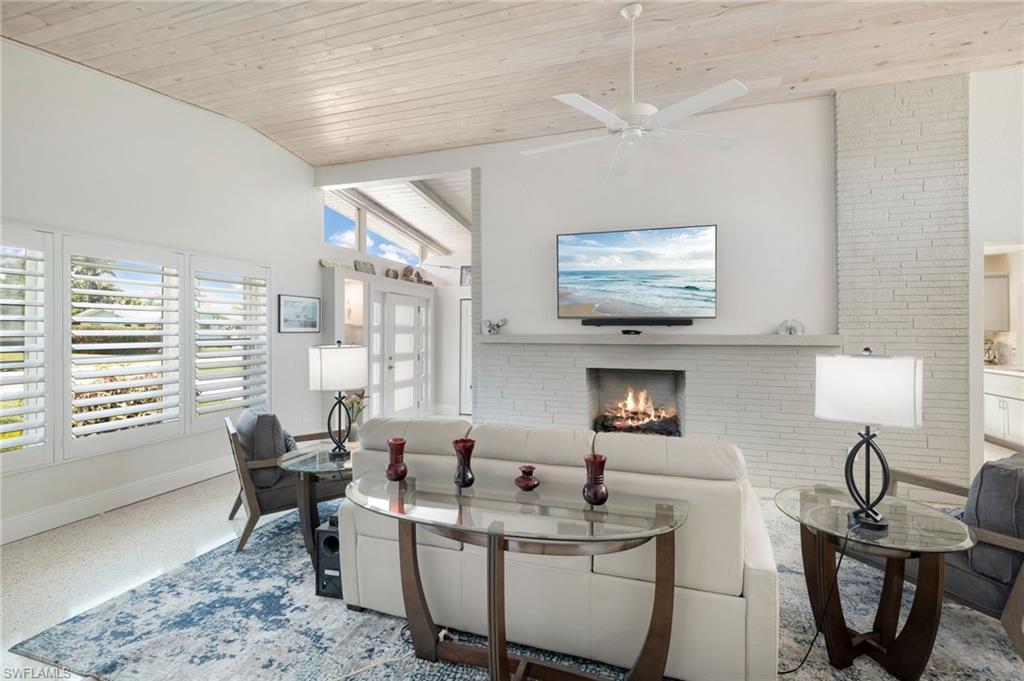 Prepare to be amazed from the moment you walk through the door. This home has been meticulously cared for!
A Soaring vaulted ceiling, with the beautiful brick fireplace, and spacious rooms create an open, airy feel that immediately impress. This waterfront home offers 2 bedrooms and 3 bathrooms, Family room and Living area, with the potential to easily convert to a 3-bedroom floor plan if desired.

The view is simply spectacular, providing a peaceful backdrop to everyday living. The lanai and patio open up to a beautiful garden area, and a walkway around the house.
Boaters will appreciate the direct Gulf-access canal with no bridges, making it easy to enjoy Southwest Florida’s waterways. A private dock and an 8,500 lb boat lift are already in place and ready for your next adventure. 

The extended 2-car+ garage provides exceptional space for vehicles, storage, or hobbies, and includes a convenient 12’ x 5’ storage room at the rear. Nice sized driveway allows Room for your boat or RV!
Additional features include a very large fenced yard, a new roof installed in 2020, and a location close to shopping, dining, and area amenities.  Prepare to be amazed from the moment you walk through the door. 

Yacht Club Colony is one of North Fort Myers’ hidden gems, offering a voluntary community association with a boat ramp, waterfront park, fire pit, picnics, social gatherings, and special events throughout the year.   Enjoy stunning sunsets, fireworks, dolphins, manatees, boats, yachts and sailboats drifting by, and a relaxed waterfront lifestyle 
Enjoy the best of both worlds-peaceful waterfront living with quick access to downtown Fort Myers, shopping, dining, and all the conveniences Southwest Florida has to offer including quick access to 1-75 for quick commuting.