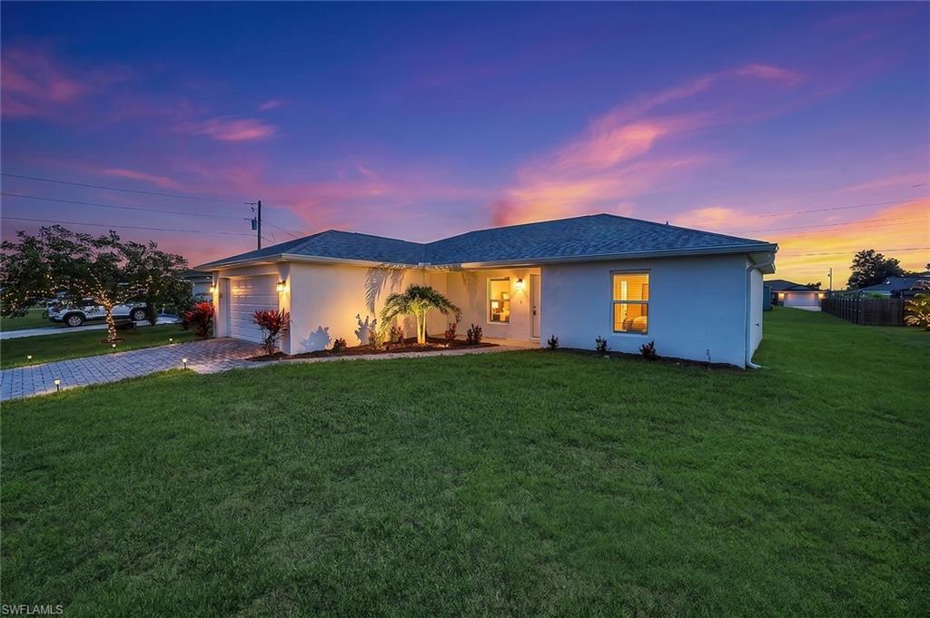 This beautifully built 2024 home offers 3 bedrooms, 2 bathrooms, and a bright, open floor plan designed for comfortable everyday living. Cathedral ceilings create a spacious feel throughout the main living areas, while the open layout makes it easy to entertain family and friends. The kitchen overlooks the living and dining areas, creating a functional space for gathering and daily life.
The split-bedroom floor plan provides added privacy, and the spacious primary bedroom offers a comfortable retreat at the end of the day. An irrigation system helps keep the lawn looking its best, and the 2-car garage provides plenty of room for vehicles and additional storage. With city water and sewer already connected, this home offers added convenience and value. The property also features desirable western rear exposure, allowing you to enjoy beautiful Southwest Florida sunsets from your backyard.
Whether you're looking for a primary residence, seasonal getaway, or investment property, this move-in ready home offers the benefits of modern construction and a functional layout. Located just north of Pine Island Road, you'll enjoy easy access to shopping, dining, and everyday conveniences, including Target, Lowe's, restaurants, grocery stores, and more, while still enjoying everything Cape Coral has to offer, including boating, fishing, golf, waterfront dining, and the Southwest Florida lifestyle.