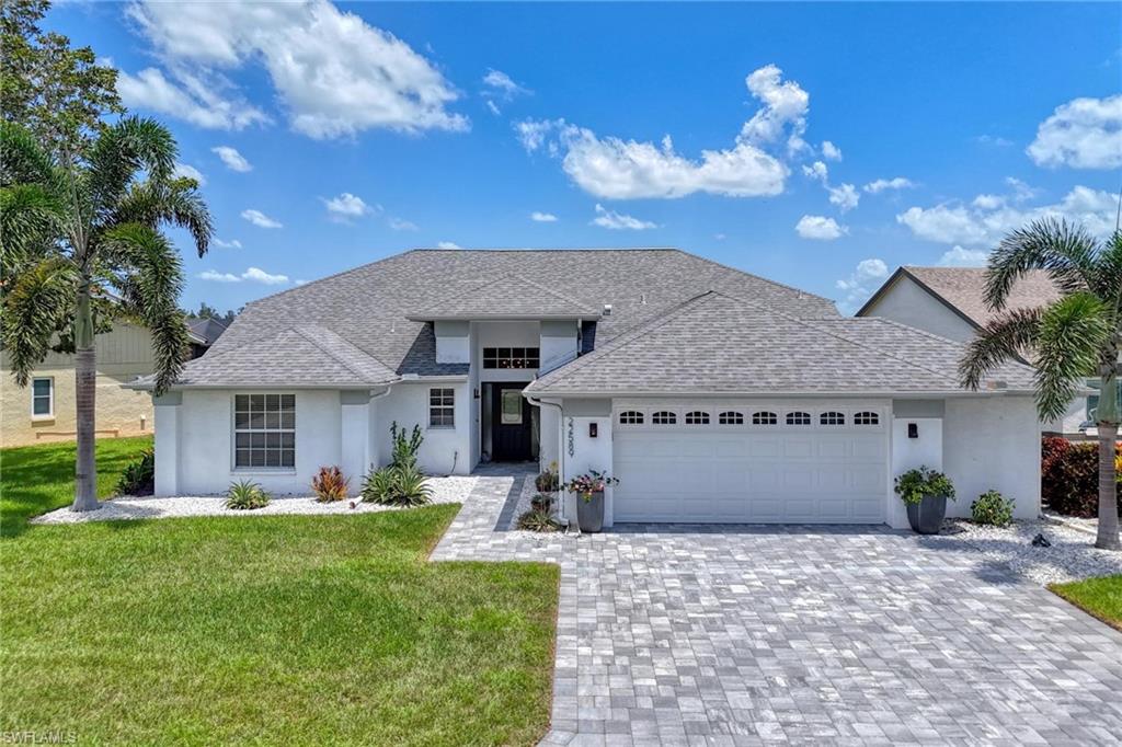 Unobstructed Lake Views in the gated community of Fountain Lakes!  This custom-built Thomas Galt home offers 3 bedrooms, 2 bathrooms, and an oversized 2+ car garage, perfectly positioned to capture breathtaking views of the illuminated fountain across the water. Designed for seamless indoor-outdoor living, this home features a wall of pocketing sliding glass doors and a picture-window screen enclosed lanai that fills the space with natural light while showcasing the stunning lake backdrop.  Extensive recent upgrades include a paver driveway and rear patio, remodeled guest and primary bathrooms, kitchen renovation, new electrical panel, new water heater, new A/C condenser, custom solar shades, updated lighting, new ceiling fans, and fresh interior paint.  The spacious primary suite offers custom California Closets walk-in closets. Additional highlights include an invisible dog fence (community allows up to three pets), ample room to add a pool, and an oversized garage with space to accommodate a golf cart - golf carts are permitted within the community.  Ideally located just minutes from Coconut Point Mall and Promenade at Bonita Bay, approximately 8 miles to Bonita Beach, and about 25 minutes to Southwest Florida International Airport.  Fountain Lakes offers low HOA fees of only $400/quarter and resort-style amenities including a bundled 9-hole par-3 golf course, tennis, pickleball, community pool, fitness center, and more.  No flood insurance required by lender.  Move-in ready - ask for complete list of improvements.