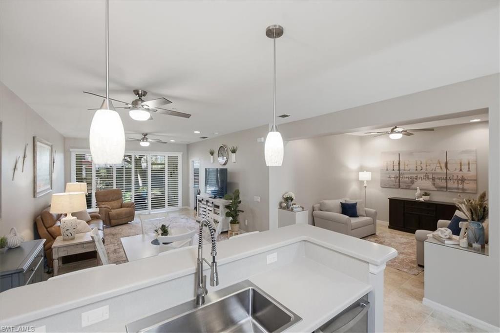 Experience effortless Florida living in this impeccably maintained, turnkey-furnished first-floor residence within the gated community of Andros at Tortuga. From the moment you arrive, the exceptional pride of ownership is unmistakable. Beautifully updated and move-in ready, this inviting home has experienced no flooding during any past hurricane events and is equipped with easy-to-open and close accordion storm shutters, providing added peace of mind.

Designed for both everyday comfort and seasonal enjoyment, the thoughtfully updated interior features white plantation shutters throughout the home, modern lighting, a beautifully renovated guest bath shower (2024), new washer and dryer (2026), a deep farmhouse sink with new faucet and disposal, Corian countertops, and a new range with a built-in air fryer. The screened front entry offers a retractable glass panel, allowing you to welcome in Southwest Florida's warm breezes while maintaining comfort and privacy.

Enjoy the convenience of a detached covered carport, an oversized driveway with ample guest parking, and an unbeatable location directly across the street from the community clubhouse and resort-style pool.

Residents of Andros at Tortuga enjoy an exceptional maintenance-free lifestyle with amenities that include a clubhouse, resort-style pool, tennis and pickleball courts, and beautifully maintained grounds. Association fees include water, sewer, trash removal, high-speed internet, cable television with three Comcast cable boxes, and exterior maintenance. Even better, there is no CDD and no capital contribution fee due at closing. The park for your four legged family members is an added feature.

Whether you're seeking a full-time residence, seasonal escape, or investment opportunity, the flexible rental policy allows up to four leases annually with a 30-day minimum, and renters may have pets—an uncommon advantage that broadens rental appeal.

Perfectly situated in the heart of South Fort Myers, you'll be just minutes from the sugar-white sands of Fort Myers Beach and Sanibel Island, Southwest Florida International Airport (RSW), world-class healthcare, Gulf Coast Town Center, Bell Tower Shops, Coconut Point, and an outstanding selection of restaurants, entertainment, and everyday conveniences.

Outdoor enthusiasts will appreciate being surrounded by some of Southwest Florida's premier golf courses, championship tennis facilities, marinas, public boat ramps, backwater and Gulf fishing, kayaking, paddleboarding, and endless opportunities to embrace the coastal lifestyle. Whether your perfect day includes an early morning tee time, boating to waterfront dining, casting a line at sunset, or simply relaxing poolside, this exceptional residence places it all within easy reach.

This is more than a beautifully maintained condominium—it's your opportunity to own a piece of the Southwest Florida lifestyle you've been dreaming about.