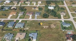 Ready-to-build 80' x 125' homesite in fast-growing NW Cape Coral, already surrounded by established homes. No wetlands, level lot, ideal for your custom home or investment build. Close to schools, shopping, and the city's expanding north end. Buyer to verify utilities, UEP/assessment status, flood zone, and setbacks. Bring your builder.