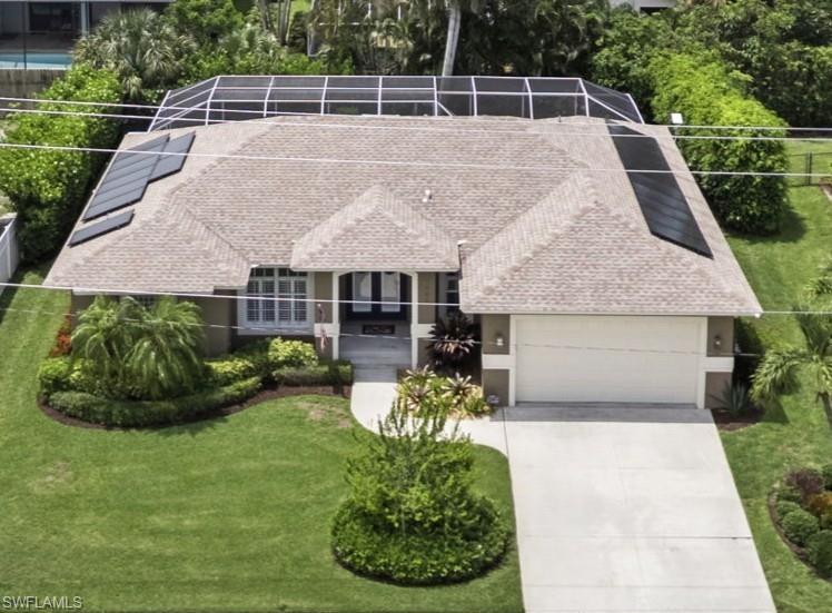 Experience the Marco Island lifestyle at an incredible price in this beautifully maintained home with expansive lanai and coveted southern exposure. This quality-built home features a new roof in 2018, new AC in 2019, and a brand new water heater.  The lanai and pool were fully refurbished in 2024 and the space was expanded to over 1400 square feet providing more space for family time or for entertaining.  The hot tub is the perfect place to unwind and enjoy the very private setting.  This perfect outdoor oasis is enhanced by new roll down electric shutters with hurricane rated fabric.  The home is wired for a whole house generator.  It also includes a roof mounted solar system which reduces your energy bills and your carbon footprint, saving money AND the planet at the same time!  Come enjoy the ultimate island lifestyle in this lovely, affordable home.