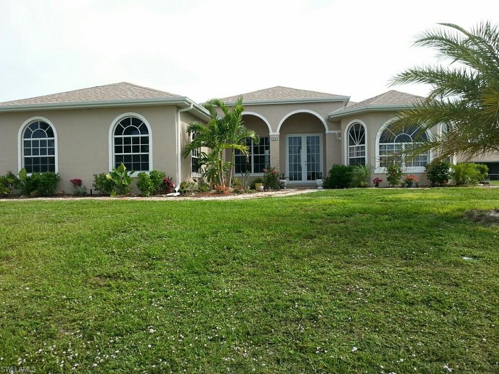 Gorgeous home in Northwest Cape.  Home has granite countertops in kitchen and baths, New Samsung black appliances, Tile throughout home, Jacuzzi tub in master, dual sinks in master bath, wrap around shower in master, sprinkler system with water to each tree, plush landscaping, screened lanai.  New water system with water softener.  Home sits on a corner lot and has a side loading garage.  Home is absolutely gorgeous and ready to move in.