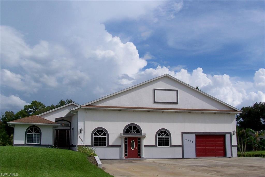 PICTURE PERFECT AND READY TO MOVE-IN HOME AND A 4000+- SQ FT HANGAR WITH A 50' X 14' DOOR OPENING! Fly home to Buckingham, a rural preserve outside the city limits. Just the right size home to be used either as a 3/3 or 2/3 plus office with Murphy Wall bed. Guest bath between the 2nd & 3rd BR and one with access to lanai and pool.  Master Bath has roomy walk in shower and dbl vanities. The floors throughout the main living are a beautiful neutral tile and the bedrooms have all been done with a very good looking Pergo Salted Lpacho finish. LR has a full mirrored wall for added dimension and breakfast area off the kitchen is bright and cheerful or you can enjoy counter seating. There's a triple panel glass slider from LR and sliders from the breakfast/dining room and MBR to the lanai and inviting swimming pool and spa. Hangar door is Hydroswing, and has been altered to appear like the front of a house with entry & garage doors & windows. Easy access without opening the whole hangar. Runway 4500' x 400' concrete, lighted, ID F59. Community roads provide taxiways. Enjoy the camaraderie of fellow pilots in this congenial, most sought after airpark community. Land & taxi home!