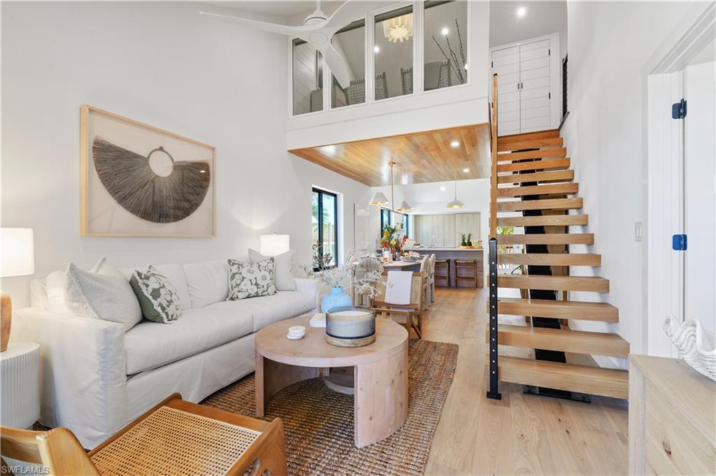 Coastal Elegence along Captiva’s coastline, where luxury and contemporary blend together seamlessly. A one-of-a-kind, fully renovated 3-Bedroom, 3-Bathroom duplex Beach Cottage, expertly reimagined by a professional interior designer to exude sophistication and comfort. Fully furnished with curated, upscale decor. Step into the heart of the home—a beautifully curated kitchen featuring Vadara Sereno Quartz countertops, high-end smart appliances with an integrated refrigerator and dishwasher, hidden coffee nook, and custom cabinetry with polished nickel hardware. The Gulf-front living and dining areas flow effortlessly, with a dining space highlighted by wood detailing and modern lighting. Smart Frame TVs throughout offer an immersive entertainment experience. Additionally, the condo is lined with luxurious engineered hardwood flooring. Walk up the floating staircase to the versatile 3-bedroom loft featuring an upper level that extends to include extra closet space, study enclave, and flexible options for use—perfect as a cozy retreat or additional sleeping quarters with a pull-out sofa. The en-suite primary bedroom features a bathroom offering quartz countertops, signature hardware, and a floor-to-ceiling tiled walk-in shower with a seamless glass door, creating a sanctuary of relaxation. Outside, the screened lanai invites you to take in breathtaking Gulf views while offering a private stairway to the pristine sandy beaches. A rare feature of this property is the custom fitted under-home storage space that is a one-of-a-kind! Rinse off the day’s adventures in the outdoor shower, beautifully fitted with navy blue mosaic tiles. Every inch of this residence has been meticulously crafted for comfort, elegance, and effortless Gulf-front living. Experience a lifestyle of unparalleled luxury in this rare Beach Cottage. Extensive feature list available.