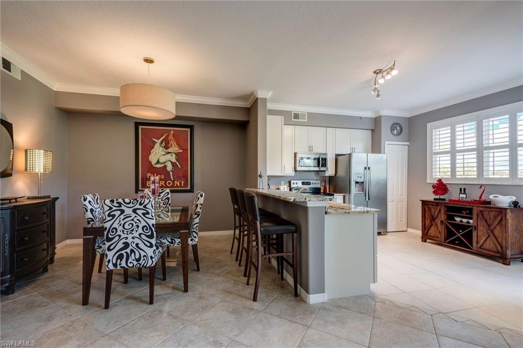 Beautifully upgraded and with a fantastic peaceful view of the golf course this ground floor condo is waiting for it's new owner to enjoy winter in Florida.  Sold FURNISHED, the unit is 2 bedroom and 2 bathrooms with a large open living area.  With the kitchen right of the lanai this unit is perfect for enjoying indoor/outdoor living.  Kitchen features new cabinets, granite counter tops and stainless appliances. This is a SOCIAL MEMBERSHIP deeded unit allowing you to enjoy all of the many amenities that Glen Eagle offers, including the state of the art Divot Fitness Center and fully remodeled clubhouse. Take a tour today!