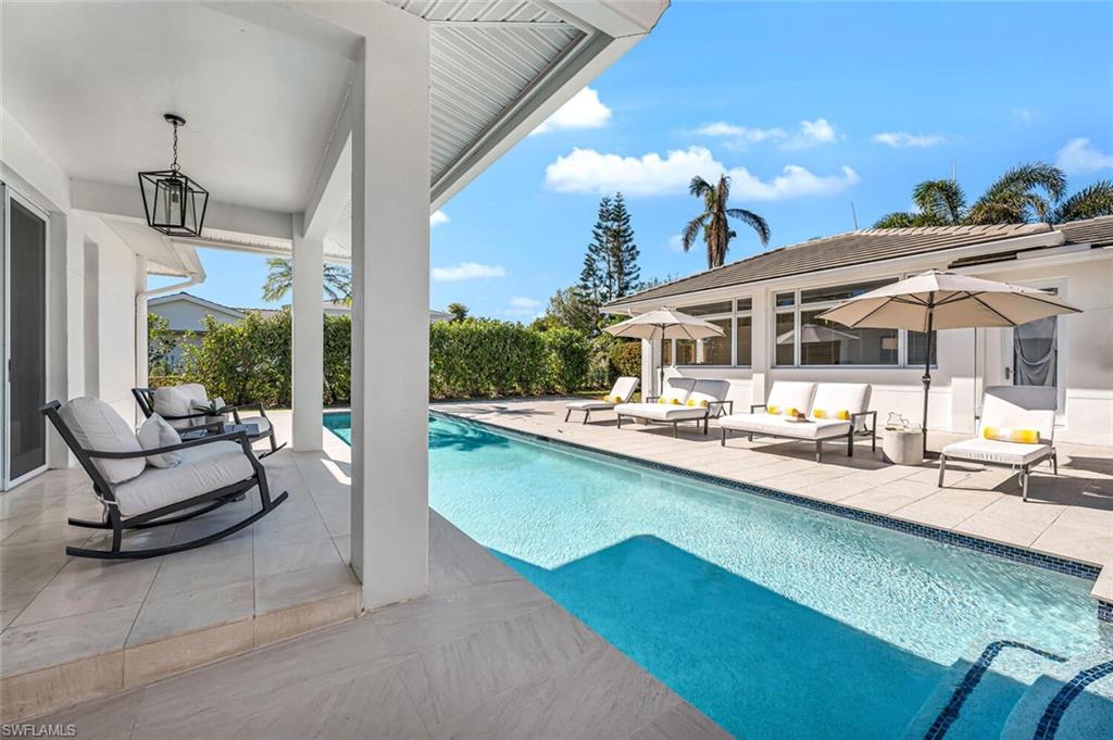Designed by a prestigious architect who used it as his own home on one of the most attractive streets in prestigious Moorings, Starboard Drive is lined with gorgeous palm trees and brand new custom residences. The home features soaring ceilings and natural light throughout the entire home. The large kitchen includes a Sub Zero refrigerator, Thermador Oven and 6-Burner Russell range. There is a large formal dining room that can easily be turned into a bedroom. Each bedroom has its own bathroom, along with brand new custom closets. Enjoy your morning coffee on your enormous screened-in lanai overlooking your brand new paved backyard and 40-foot pool. The backyard is fully fenced in and features an outdoor shower and automatic sprinkler system. The home is a mile from the beach and centrally located, close to Downtown, Waterside Shops and Mercato. The home features a guest house with its own bathroom that allows you and your guests to have privacy. During Hurricane Ian, no water encroachment at all! Access to the private Moorings Beach. Truly, a dream home!