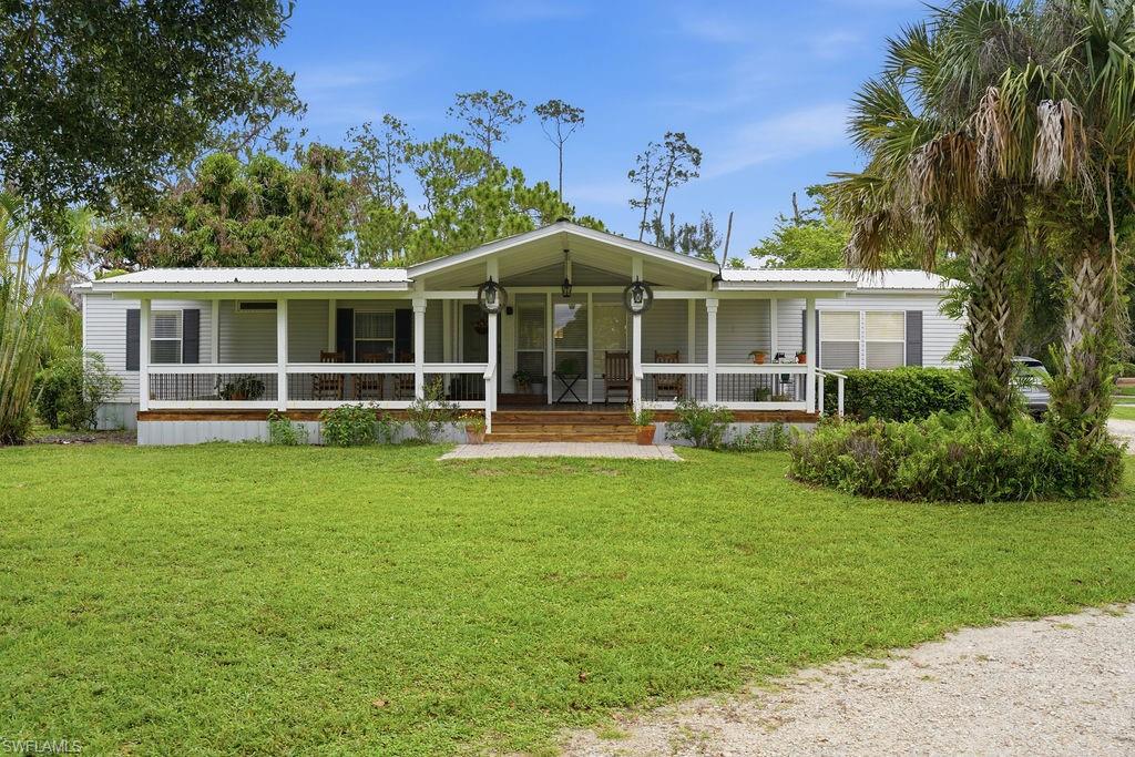 Listed Below Appraised Value! Don’t miss this incredible opportunity to own your own private slice of country paradise on 1.89± acres.

This beautifully renovated manufactured home offers the perfect blend of comfort, functionality, and outdoor living. The property is fully fenced and secured with an automatic entry gate, featuring two wells, irrigation, and an impressive collection of mature fruit trees including mango, avocado, lemon, loquat, fig, and banana trees.

Gardening enthusiasts will love the multiple raised garden beds and trellis systems for vertical growing, while animal lovers will appreciate the chicken coop and dog pens complete with water and electric service.

Enjoy peaceful canal frontage and plenty of room to spread out. The standout feature is the massive barn, which includes an incredible hobby and entertaining space complete with a full kitchen and full bathroom, making it ideal for gatherings, workshops, hobbies, and hosting family and friends.

Whether you’re looking to homestead, garden, entertain, or simply enjoy a quieter lifestyle with room to grow, this property offers endless possibilities. Select furniture may be available for purchase separately.

Properties like this don’t come along often—schedule your private showing today!