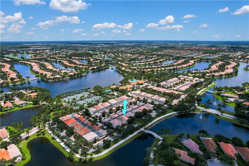 Fantastic opportunity to own in a unique gated Naples community! Offering a peaceful lake view from the front of home, easy walk to all amenities which include USPS, restaurant, and gas station! Meticulously cared for & updated- new a/c March 2020; replaced mounted lights in living room, new fridge & dishwasher 2017; washer/dryer replaced in 2012; LED lighting in recessed lights, new laminate flooring in second floor master, first floor all tile, and freshly painted interior & lanai floor. All bedrooms are situated on the second floor and all have custom closet systems, on the first floor you will find a living room, family room kitchen w/ breakfast bar, laundry closet, half bath, and huge under staircase storage room. A massive lanai connects the home & 2-car garage- this lanai has plenty of room for a pool/spa if desired and provides you with amazing outdoor living space. Island Walk is a beautiful community that is gated & has guard 24/7. The lakefront Town Center that offers activities for everyone- social planned events, tennis, bocce ball, fitness center, exercise classes, pickleball, resort style pool, lap pool, lawn bowling, putting green. Rooms are virtually staged.