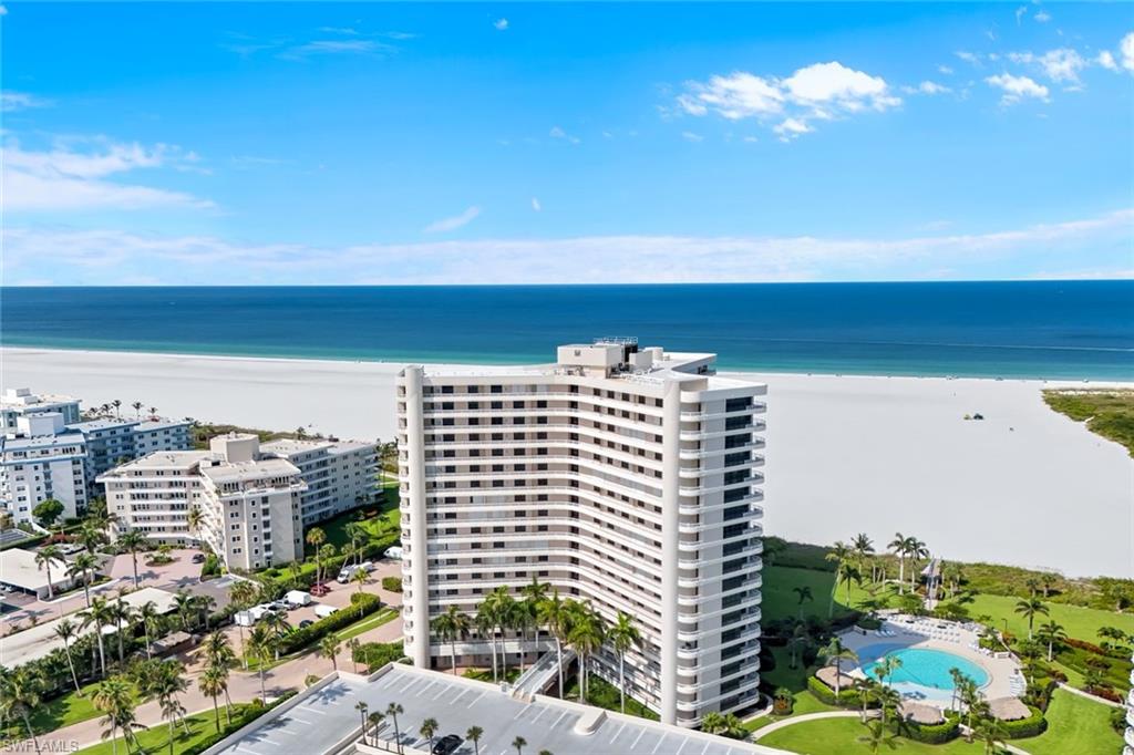 AVAILABLE FROM JUNE THRU OCTOBER $1100.00 PER WEEK (2 WEEK MINIMUM) Coastal Elegance at South Seas Towers on Marco Island. Located on the 4th floor and nestled along the pristine shoreline of Tigertail Beach, this beautifully appointed two-bedroom, two-bathroom condominium is offered Turnkey and exhibits the quintessential Marco Island lifestyle. This condo's south-facing vantage point with captivating views of the majestic Gulf of Mexico and the powdery white sandy beach provide a picturesque backdrop for everyday living and memorable moments alike. Once inside, discover a spacious great-room layout that effortlessly blends comfort with sophistication. The inviting dining area creates a perfect space for entertaining or unwinding. The kitchen is both stylish and functional, featuring crisp white raised panel cabinetry, stainless steel appliances and elegant countertops. The bedrooms offers two serene retreats, each with updated bathrooms and access through the impact resistant glass siding doors onto the expansive balcony spanning the entire width of the condo to take in sweeping coastal views just perfect for morning coffee, evening cocktails, or alfresco dining. The recently renovated lobby, common areas and hallways throughout the building add a touch of modern upscale luxury to your everyday experience. South Seas Towers is a 24-hour guard-gated community that offers exceptional peace of mind with secure garage parking and on-site management. Resort-style amenities abound: enjoy direct beach access, a tropical heated pool, available boat slips, and kayak storage for water enthusiasts. Stay active with tennis and pickleball courts, bocce, shuffleboard, and a fully equipped fitness center. Whether you're looking for a serene beachfront escape or an active coastal lifestyle, this residence at South Seas Towers delivers the perfect blend of luxury, leisure, and location—where every detail is designed to elevate your living experience.