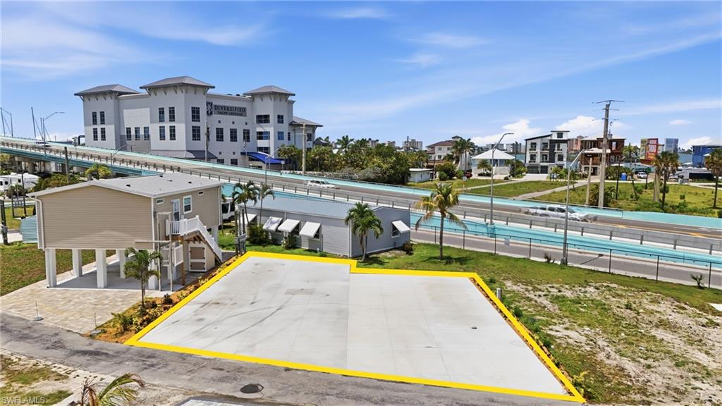 Welcome to Gulf Cove Trailer Park Co-Op, a rare opportunity to own two side-by-side lots in one of San Carlos Island’s hidden waterfront communities just moments from Fort Myers Beach. Lots 32 and 33 are being offered together as a package deal, creating an oversized footprint rarely available within this highly sought-after 55+ co-op community. Completely paved with updated landscaping already in place, the property offers a clean, low-maintenance setup ready for immediate enjoyment or future redevelopment.

Located at the gateway to Fort Myers Beach, Gulf Cove places you near marinas, waterfront dining, boating, fishing, entertainment, and the island lifestyle Southwest Florida is known for. Ownership within Gulf Cove includes a 1/60th interest in the entire co-op community, creating a unique blend of private ownership and community-oriented waterfront living on San Carlos Island.

Gulf Cove is a gulf-access oriented waterfront community, with the Board of Directors currently working through a future process for boat slip assignments. Throughout the community, residents enjoy bay, marina, and water views along with the convenience of being surrounded by ongoing redevelopment and investment in the Fort Myers Beach area.

Major infrastructure improvements have already been completed throughout the community, including sewer, water, and electric services. The expansive paved configuration of these combined lots creates flexibility for RV/Park Model use, outdoor entertaining, parking, or future elevated residential construction.

Future homes within Gulf Cove are required to meet current FEMA elevation standards, generally requiring construction approximately 8–10 feet above grade. This opens the door for elevated coastal home concepts with open-air entertaining areas, covered parking, storage, or additional outdoor living space below. The double-lot setup provides additional design flexibility that is difficult to find within the community and may allow for expanded custom home concepts or multiple structures subject to approvals.

Quarterly HOA fees of approximately $800(per parcel) include lawn and land maintenance, sewer, water, trash removal, street maintenance, and community upkeep, helping keep ownership simple and manageable. Whether you are looking for a seasonal retreat, RV getaway, future island home site, or long-term investment within a revitalizing waterfront community, Lots 32 and 33 offer a unique opportunity to secure a larger presence in one of Southwest Florida’s most desirable coastal locations.