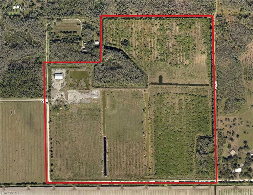 Positioned in a rapidly growing corridor just south of LaBelle and conveniently located between LaBelle and Immokalee, this expansive 144.5-acre property at 960 G Road presents a prime opportunity for agricultural investment or rural enterprise. Surrounded by warm climate conditions ideal for year-round productivity, the land is well-suited for a wide variety of uses including row crops, livestock, or other agricultural ventures.
 
The property features a substantial 55' x 125' steel warehouse, offering excellent space for equipment storage, operations, or future improvements. Existing infrastructure includes well, septic, and electrical service already in place, providing a strong foundation for development or continued agricultural use. The acreage is fenced, though portions will require repair, and includes canal systems that may assist with drainage or irrigation. 

With road frontage on two sides, access and flexibility for future use or division are key advantages of this tract.
 
Please note: The property is being sold As Is. It has experienced vandalism, and the current absentee owner has not been able to oversee cleanup or restoration. This is reflected in the price.

Whether you're expanding an agricultural operation, seeking a land investment, or looking for a large private holding in a growth area, this property offers significant upside at an attractive scale.