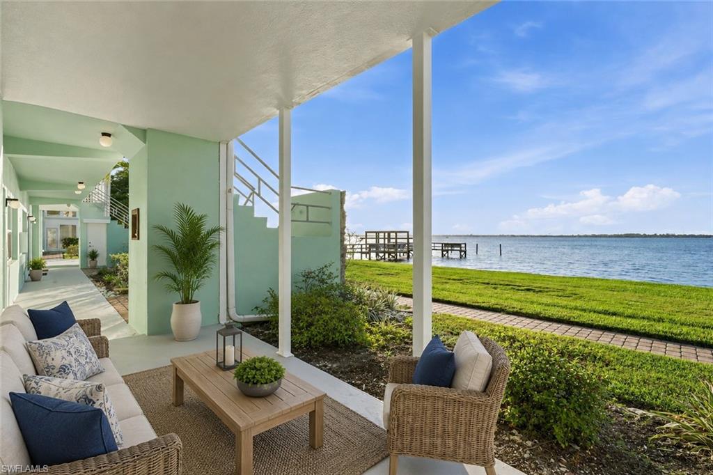 Discover serene riverfront living in this completely renovated first-floor condo in the charming River Garden community. With direct Caloosahatchee River frontage and northwest exposure, every day brings stunning waterfront views and unforgettable sunsets that make you feel deeply connected to nature. The location delivers peaceful living while being just minutes to historic Downtown Fort Myers with its vibrant dining, shopping, and cultural scene. Inside, the space is thoughtfully designed and beautifully updated—featuring modern finishes and a smart layout that maximizes every square foot. The entire unit was beautifully renovated in September 2024, including a full plumbing update, Lovolor custom blinds throughout, and in-unit laundry—a huge bonus for convenience and everyday living—blending modern functionality with thoughtful details. River Garden offers a small, quiet, park-like setting with river access, an extended fishing pier, kayak launch and storage, community boat dock, and scenic spots to relax and enjoy Florida’s natural beauty. Tarpon Pier has just reopened and is a 175-slip marina in a sheltered deep-water cove, offering fuel, pump-out, overnight docking, showers, shore power, boat and kayak rentals, and yacht or fishing charters. It’s the perfect place for fishing, enjoying sunsets, and connecting with the water. The community itself is exceptionally well-maintained, with the roofing replaced in 2022 and the seawall in 2019. No outstanding or upcoming assessments are anticipated, and Building D illustrates what the completed patios will look like, with Building C patios expected to finish late February–early March. This is a rare opportunity to own a truly special riverfront home that blends peaceful charm with modern comfort, in-unit convenience, and daily waterfront inspiration.