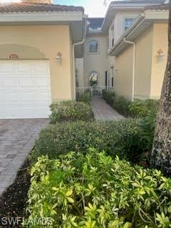 Bell Tower Park - Carriage Home completed in 2006.  First floor condo with 2 beds, 2 baths, den, attached lanai, paver driveway, one car attached garage 1,634 square feet