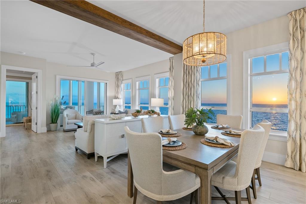 Imagine waking up to the sound of the waves and ending the day with watercolor sunsets. Penthouse #1 is the best that the Barefoot Beach Club has to offer. This 3 bedroom, 3 bathroom residence was completely reimagined in 2021 by an award-winning team: complete renovation by Potter Homes and interior design by Adelyn Charles; this home is truly a showstopper! As the southernmost penthouse, PH1 offers unobstructed views from Naples all the way to Sanibel Island with glimpses of the back bay. 10’ ceilings and 8’ doors throughout, coupled with an open floor plan, make this unit live more like a single-family home than a condo. After a long day at the beach, you can unwind in the spacious primary suite that features a spa-like bathroom, walk-in closet, and small private office. The kitchen overlooks the white sand and has been outfitted with a cabinet-finished Thermador appliance package with an induction cooktop, quartz countertops, and a large center island perfect for prep and entertainment. You will naturally find yourself drawn to the wraparound lanai at the end of the day to take in the stunning sunsets. This room has been fully enclosed with 10’ impact sliders and windows, providing a cruise ship like feeling, and can serve as additional air-conditioned space should you desire. This unit is being sold fully furnished. Residents of this penthouse enjoy access to a range of amenities, including a resort-style swimming pool and spa, a renovated fitness center with direct beach views, a full clubhouse, and the option to join the Club at Barefoot Beach. Whether looking for a peaceful retreat or a vibrant social scene, this penthouse offers the best of both worlds. Conveniently located, Barefoot Beach is just a short drive to world-class dining and entertainment such as Mercato, The Waterside Shops, 5th Ave S, and is only 30 minutes to RSW and the Naples airport. Schedule your private sunset showing today!