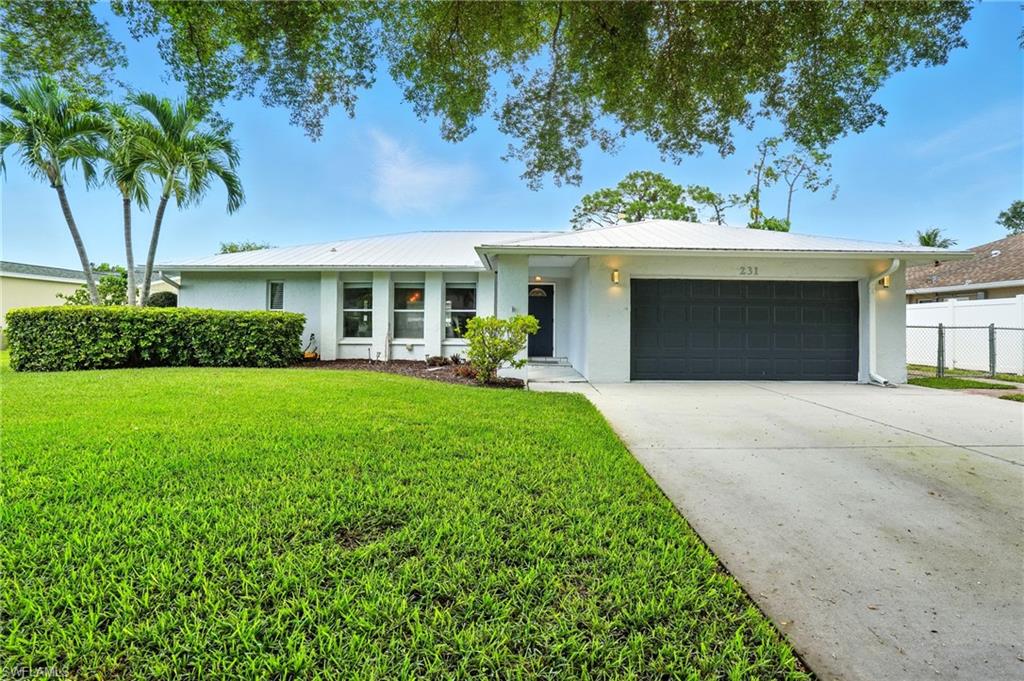Beautifully maintained single-family pool home in Willoughby Acres,  one of North Naples’ most desirable neighborhoods with no HOA fees. This 3-bedroom, 2-bathroom residence features a split-bedroom floor plan, an attached 2-car garage, and the convenience of an indoor laundry room. The recently updated kitchen boasts classic white shaker cabinets, stainless steel appliances, and a peninsula with extra counter space and seating—perfect for entertaining! From the kitchen sink, enjoy views of the sparkling pool and lush backyard. The spacious primary suite is privately situated away from the guest bedrooms and offers a custom walk-in closet along with private access to the screened-in patio. Step outside to your own backyard oasis, complete with a pool, above-ground spa, outdoor fireplace, and storage shed. The fully fenced yard provides privacy and security—ideal for kids and pets. Notable updates include a metal roof (2018), new AC and plumbing (2022), and a newer water heater (2019). Willoughby Acres is known for its quiet streets, friendly community, and unbeatable location—just minutes from shopping, dining, Collier County parks, and the beautiful beaches of Naples.