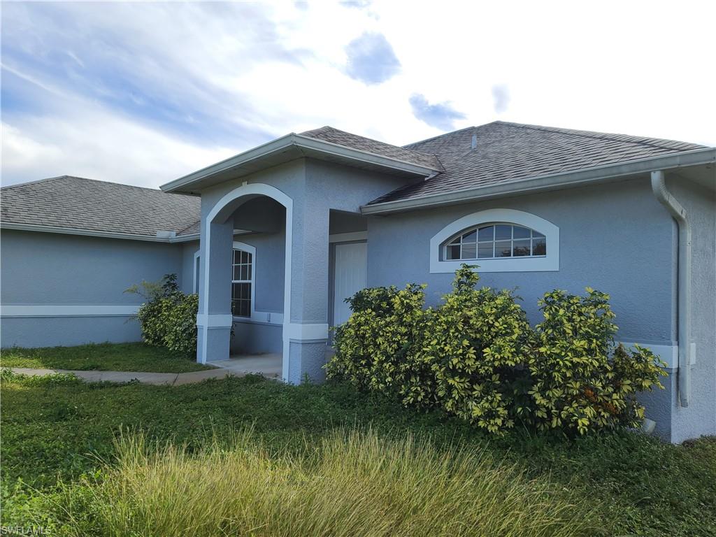 Beautiful Home in Lehigh Acres,  4 Bedrooms & 2 Baths.  Great Location! Easy access to Fort Myers. Spacious open floor plan.  Title thru out the living area,  new carpet in bedrooms, fresh paint in and out.  Screen Lanai 322 Sf entertainment space. Own your own piece of Paradise in South West Florida. While prices still affordable.