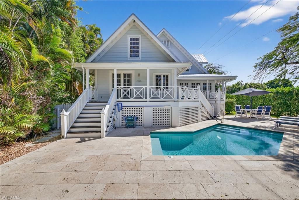 Ideally located in the heart of Olde Naples, this beautifully renovated five-bedroom, four-bath Key West–style residence offers an exceptional blend of coastal charm and walkable luxury. Just steps from Fifth Avenue South, Gulf beaches, and directly across from Cambier Park. 
The residence features a spacious open floor plan with vaulted ceilings, Miami-Dade pine floors, and timeless beadboard details. The living, dining, and kitchen areas flow seamlessly, creating an ideal setting for both relaxed coastal living and elegant entertaining with room for large family gatherings.
Recent improvements include a new standing seam metal roof and a new main air conditioning system installed in 2025, offering enhanced durability, efficiency, and peace of mind. Outdoor living is highlighted by a heated swimming pool,  multiple lounge and grassy lawn areas.  This is a rare opportunity to own a classic coastal home in a premier walk-to-everything location in Olde Naples. Excellent rental history.