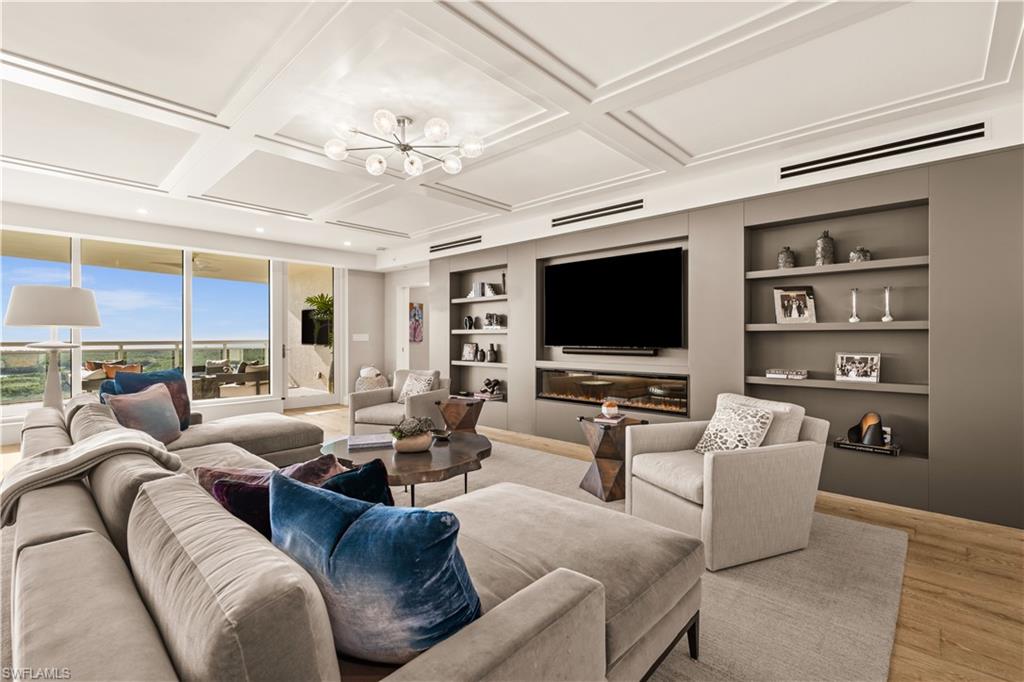 Welcome to elevated luxury in Kalea Bay’s Tower 200, where this exquisite 10th-floor residence delivers the perfect blend of refined design, breathtaking views, and effortless sophisticated  living—paired with one of Naples’ most coveted resort lifestyles.
Arrive in style via your secured elevator entry, opening directly into a home that feels both grand and inviting. Inside, over 30 feet of floor-to-ceiling glass frames sweeping views that truly take your breath away, filling every main living space with natural light and Gulfside beauty.
This 4-bedroom, 4.5-bath floorplan showcases a luxury level of finishes and upgrades, including custom built-ins, wallcoverings, stunning wall and ceiling detailing throughout, and a thoughtfully curated interior that feels timeless and sophisticated. Each of the three guest suites offers its own en-suite bath—ideal for hosting family and friends in complete comfort and privacy.
The gourmet kitchen is beautifully appointed with Wolf and Sub-Zero appliances, including a wine cooler, double dishwasher, and natural gas, creating a space equally suited for entertaining or everyday elegance.
Step outside to the expansive lanai—an effortless extension of your living space—perfect for dining, relaxing, and enjoying Naples’ legendary sunsets and breezes.
The owner’s suite is a true spa-like retreat, featuring a built-in fireplace, a luxurious bath with soaking tub and oversized shower, with sliding glass doors—your perfect escape for morning coffee or a quiet evening under the sky.
Beyond your residence, Kalea Bay offers an unmatched coastal experience with access to The Club at Kalea Bay—a world-class destination featuring resort pools, multiple dining venues, an extraordinary wellness center, and the luxury of a true “everyday vacation” lifestyle. Tower 200 adds its own signature touch with a stunning rooftop pool deck and open-air fitness, creating the ultimate setting to unwind, recharge, and take in the views from above.
A rare opportunity to own a residence that combines high design, resort amenities, and the exceptional lifestyle that defines Kalea Bay.
Your  sanctuary awaits.